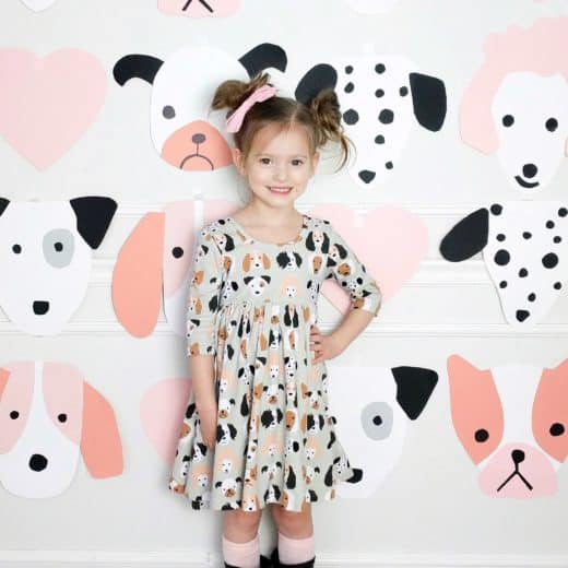 little girl In puppy themed dress