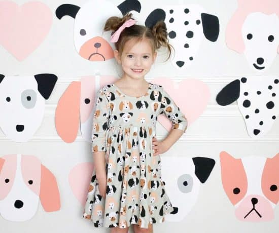 little girl In puppy themed dress