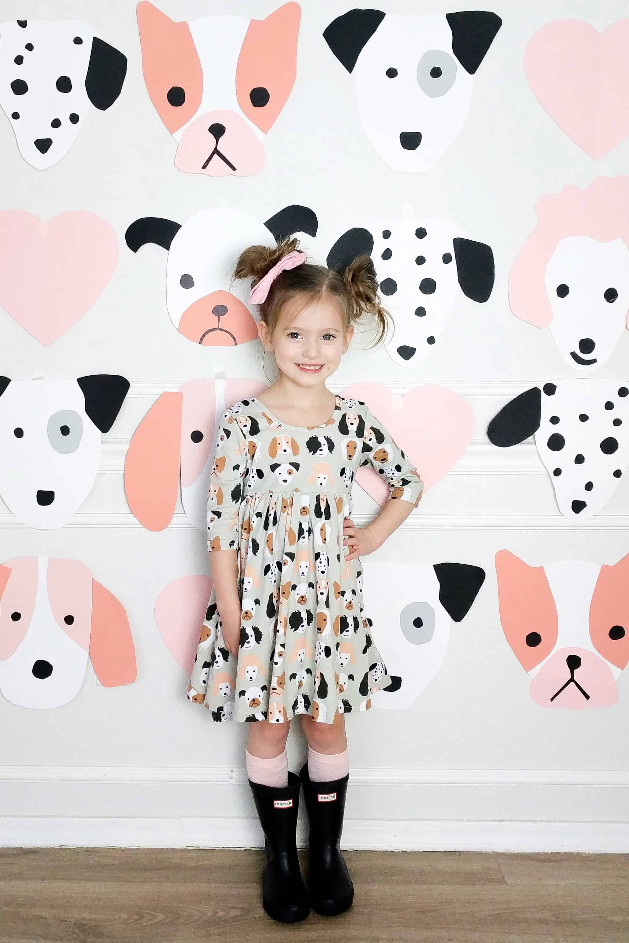 little girl In puppy themed dress