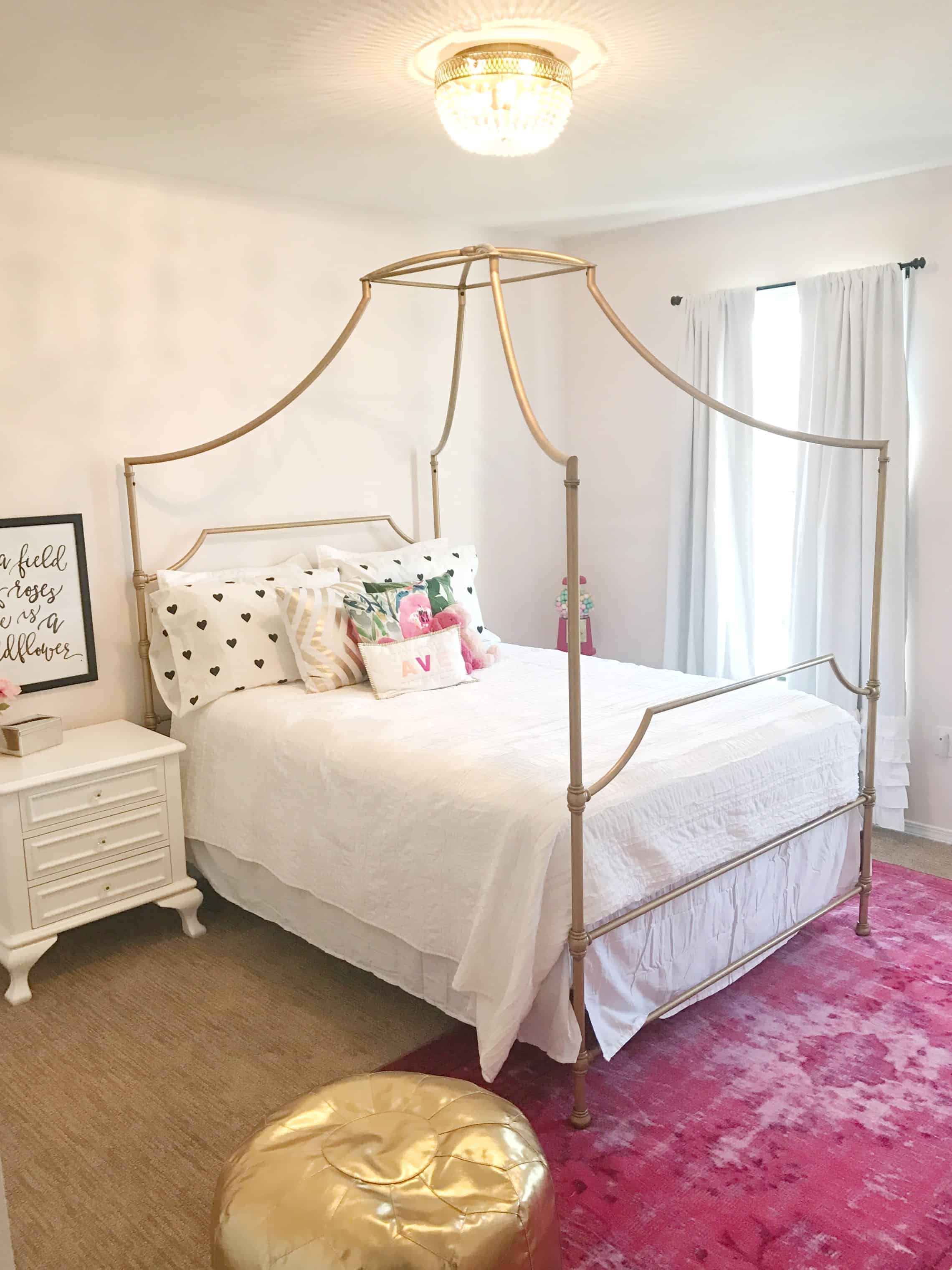 PB teen mason bed styled with white bedding and pink rug