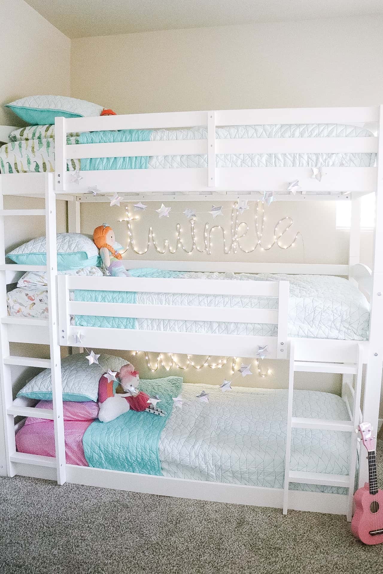 triple bunk beds in a room for siblings