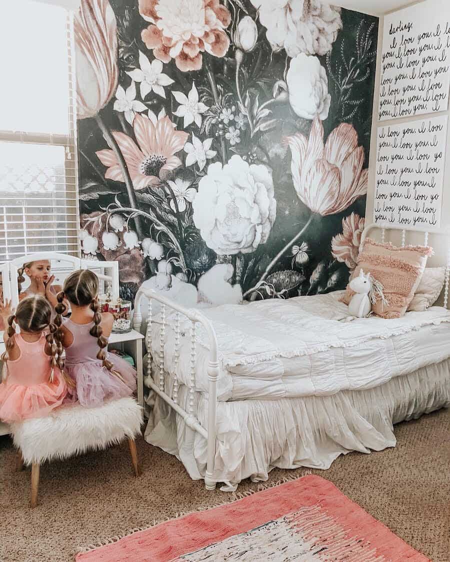 toddler girl room with black and floral wallpaper