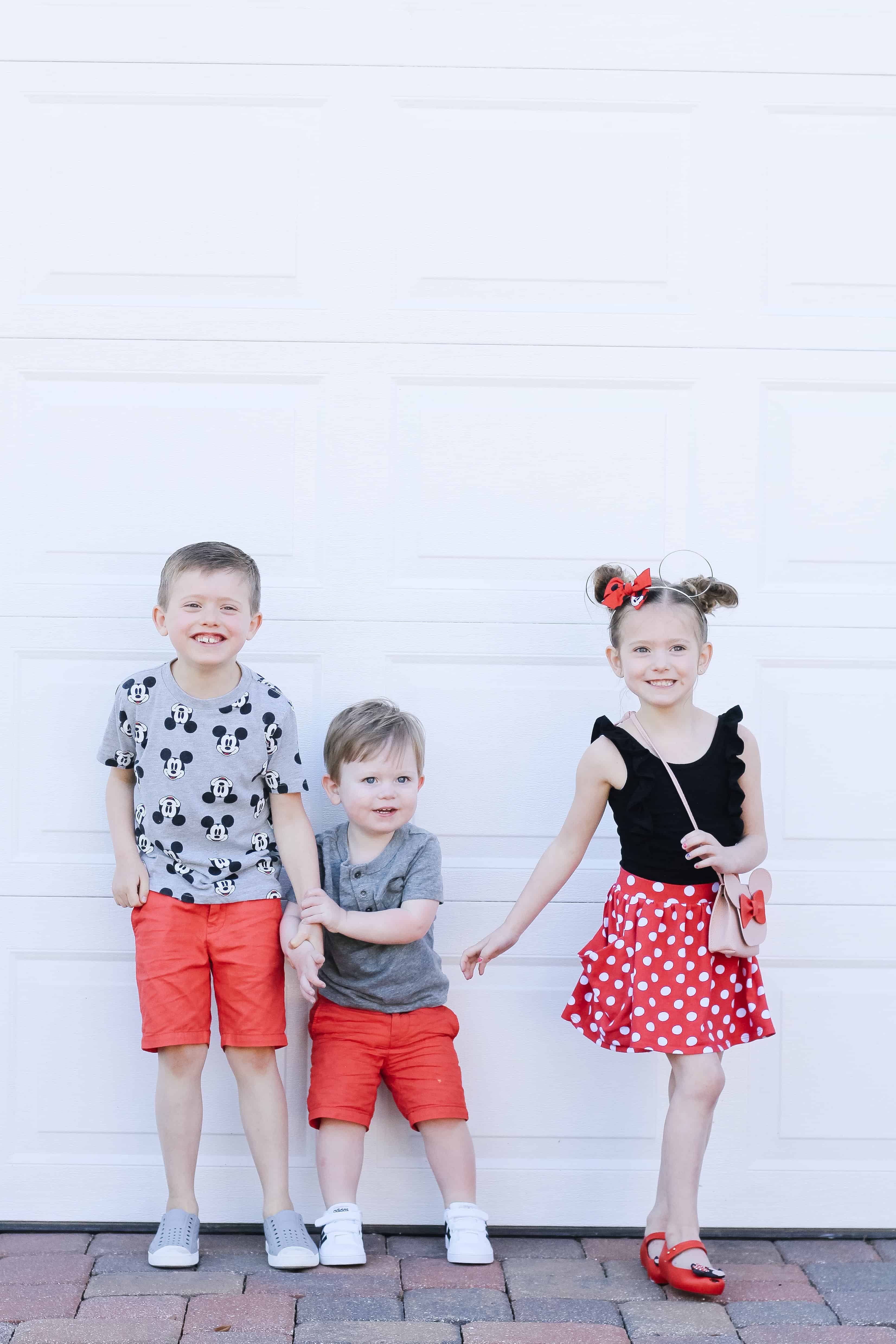 Three Siblings Dressed for Disney lined up