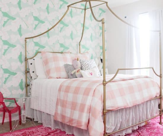 toddler girl room with pink and green wallpaper, pink rug, gold bed and pink gingham bedding - tips for hanging Spoonflower water activated wallpaper