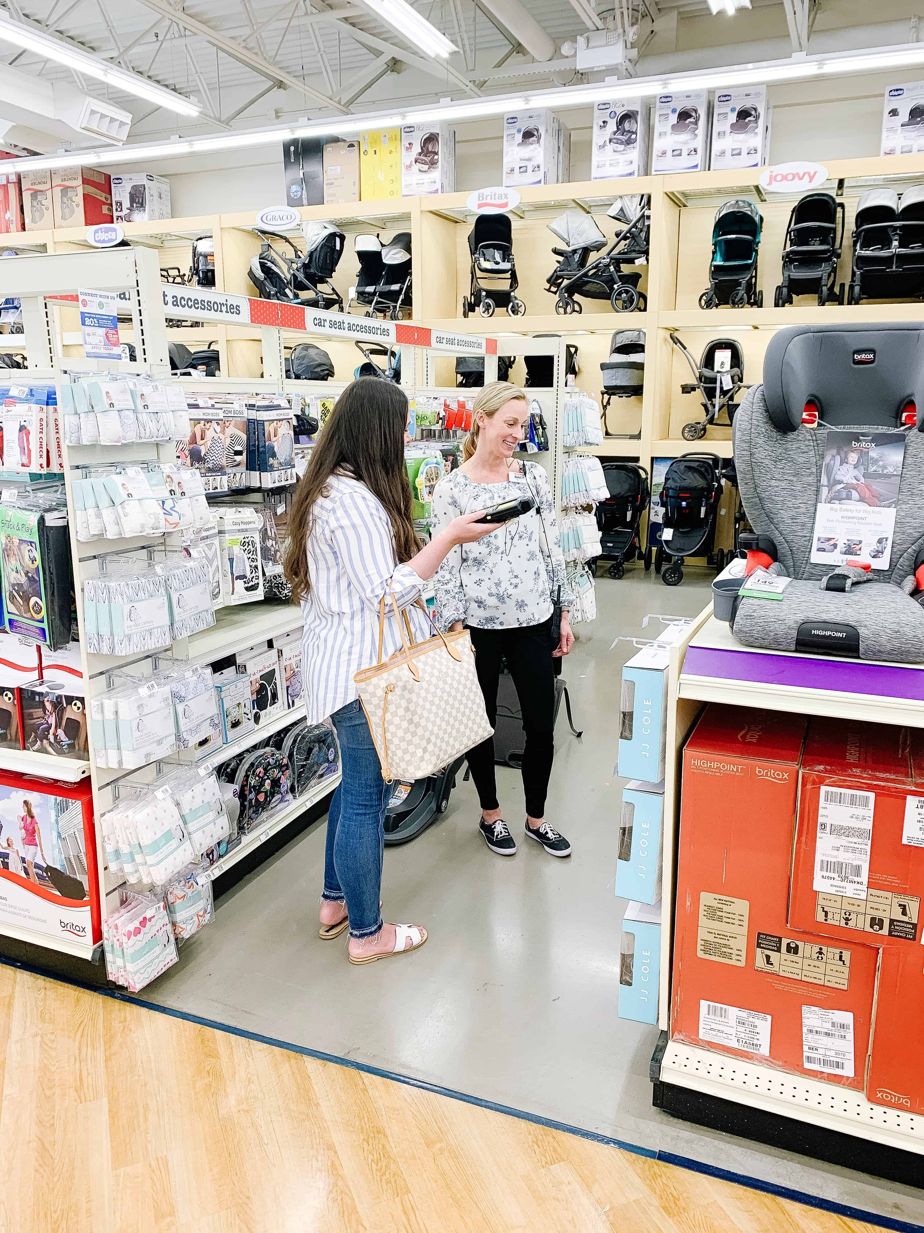 woman talking to buy buy baby employee in store