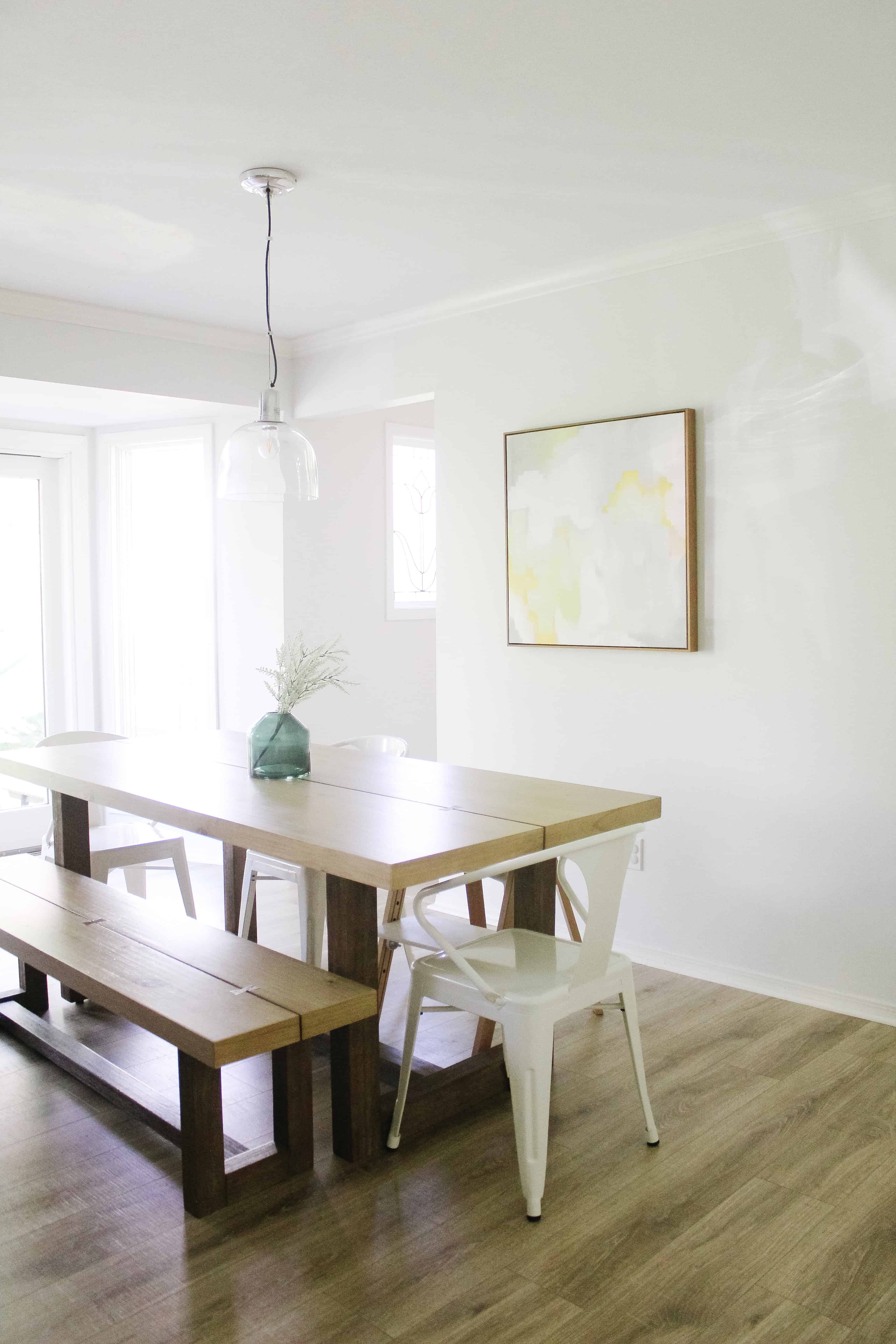 view of kitchen with table and pretty picture on wall