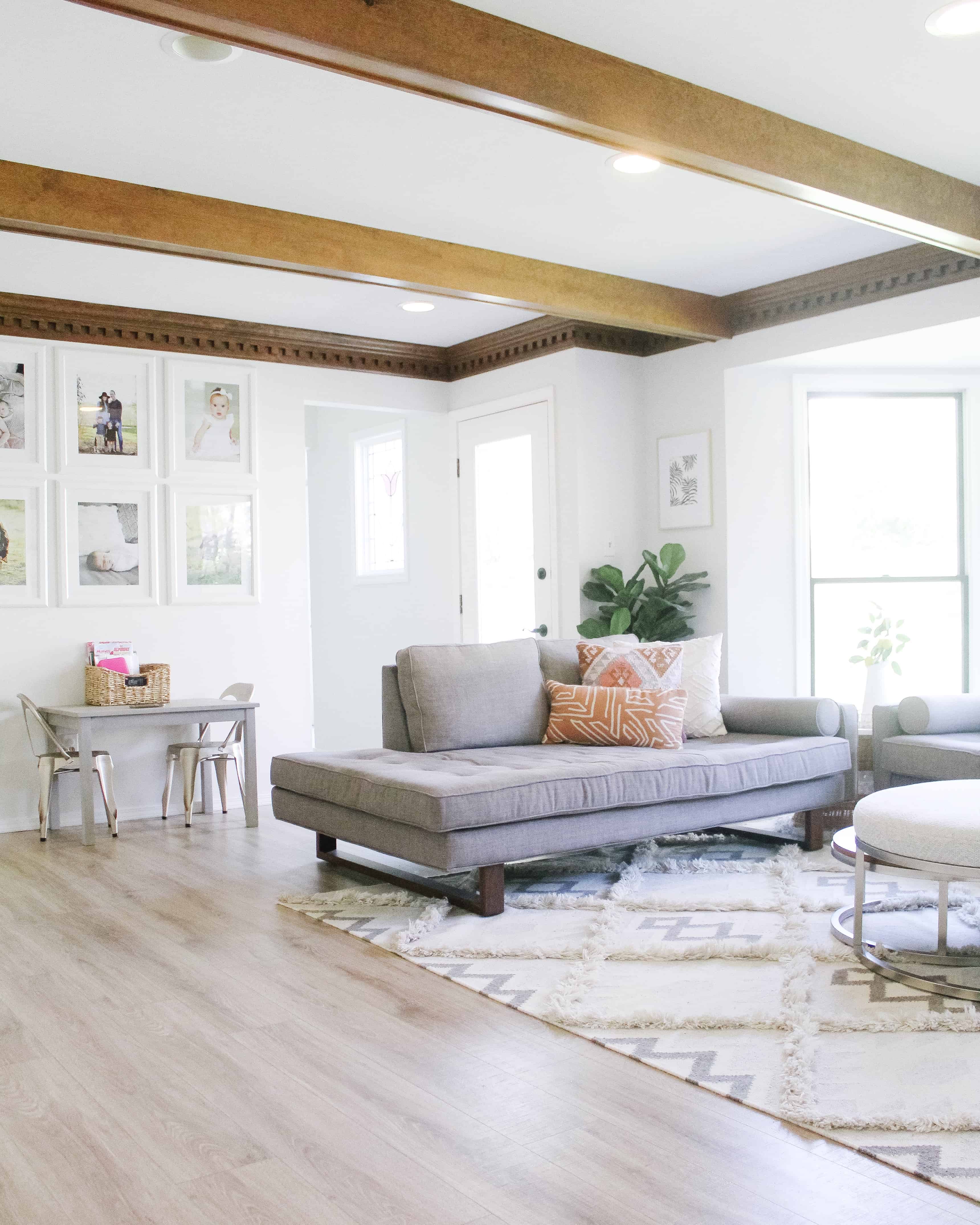 View of living room with grey Jonathan Louis Couches