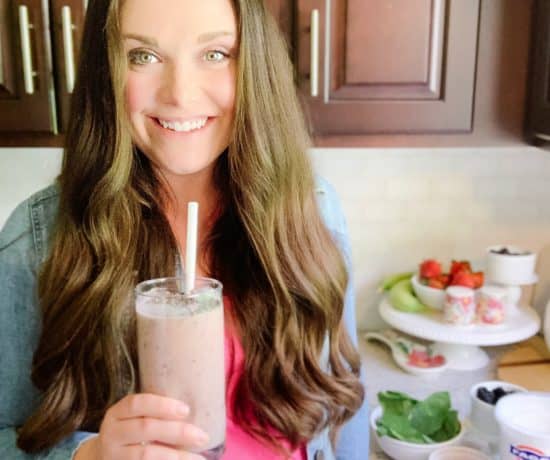 pregnant woman drinking a smoothie