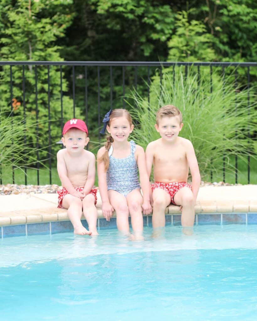 siblings in patriotic swimsuits