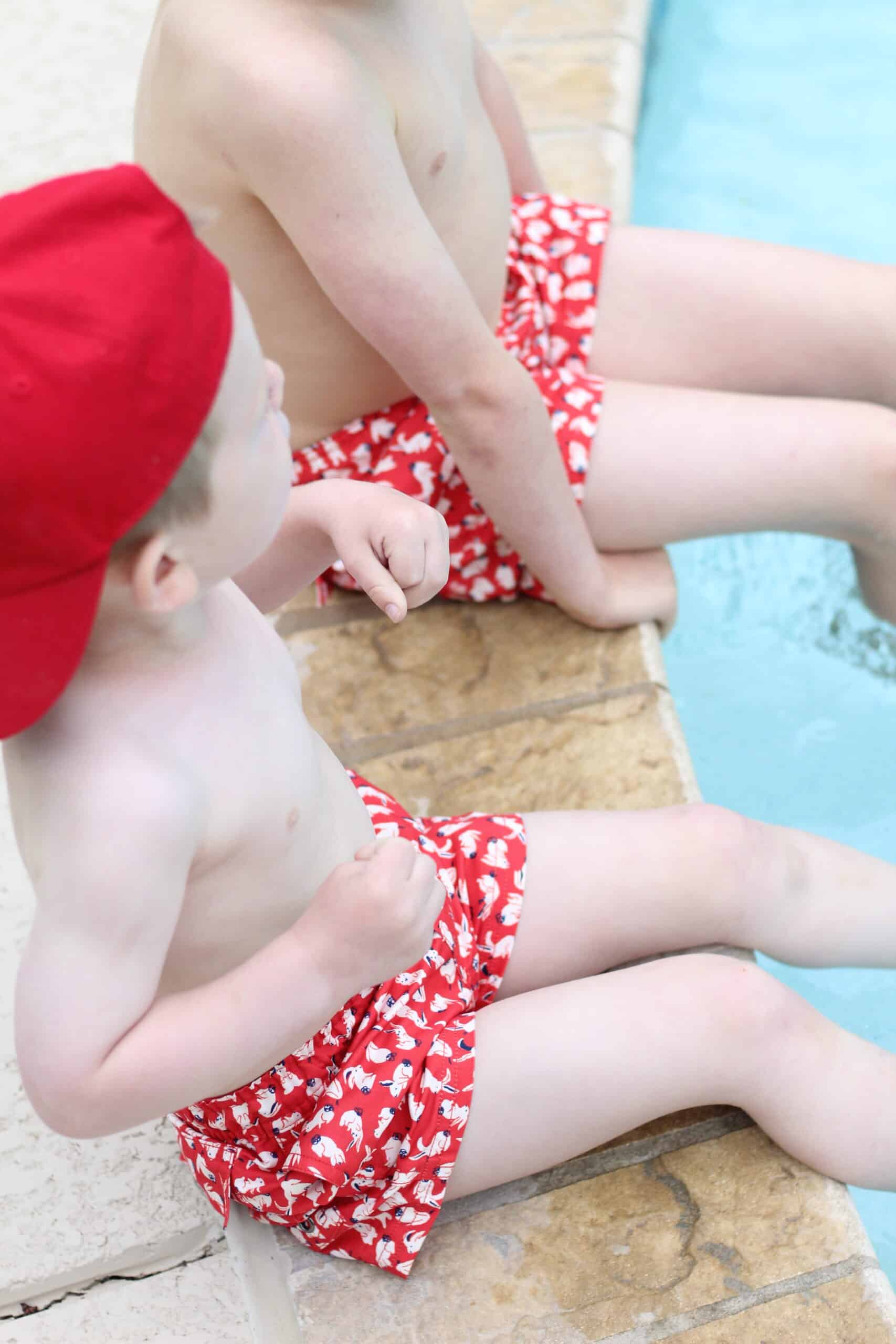 brothers in 4th of July swimsuits