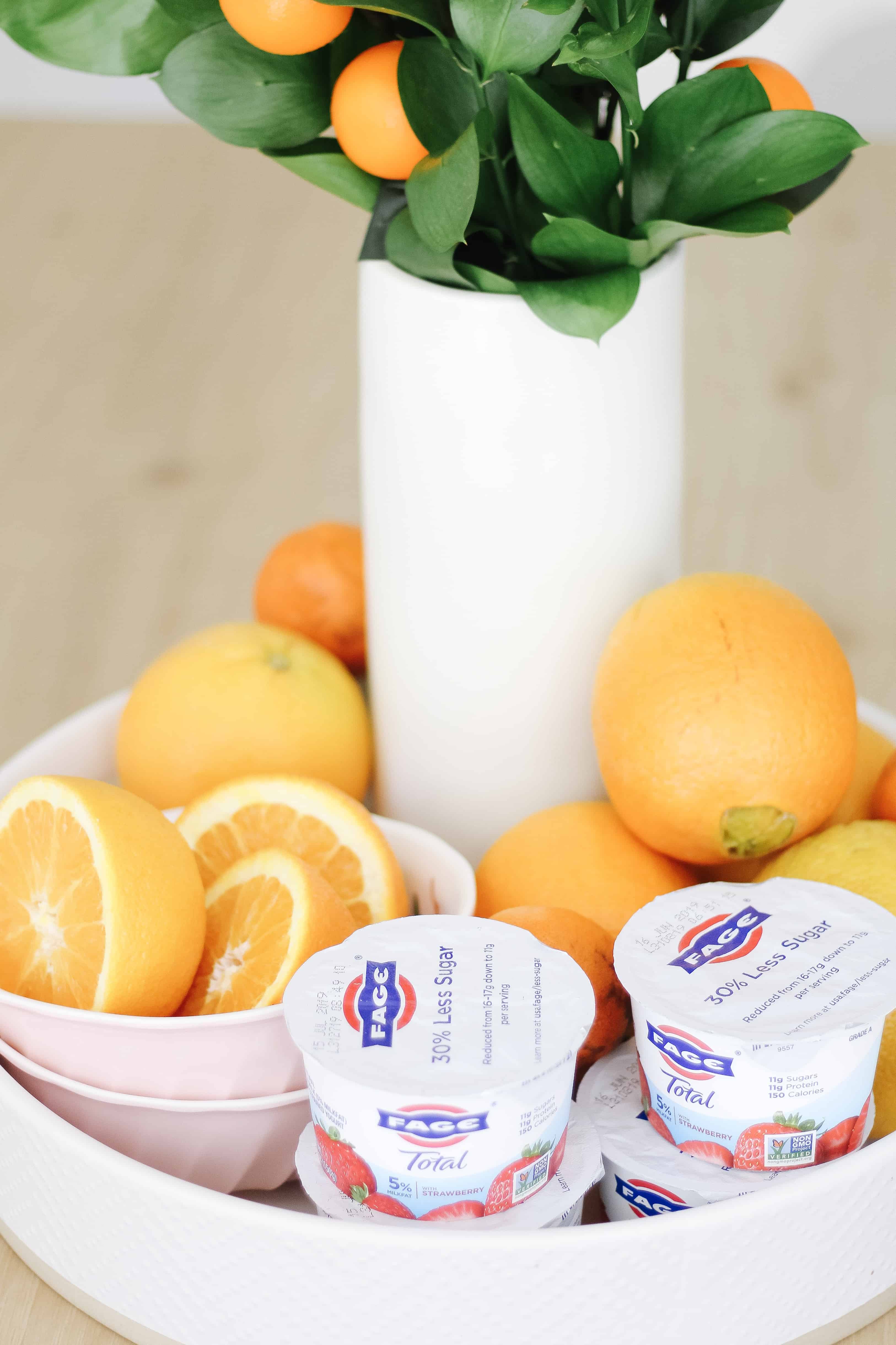 Fage yogurt on tray with oranges 