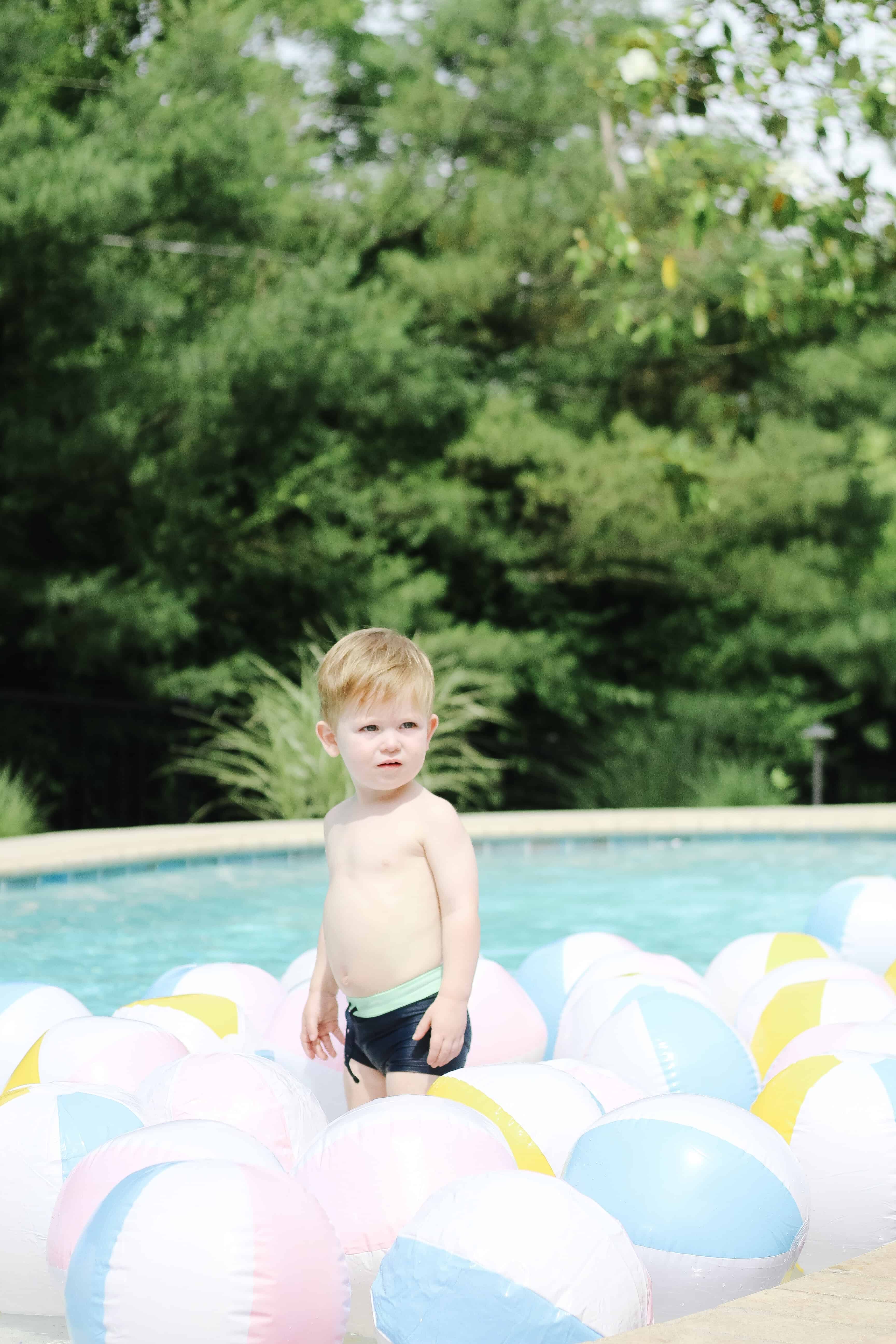 Toddler boy in beach balls