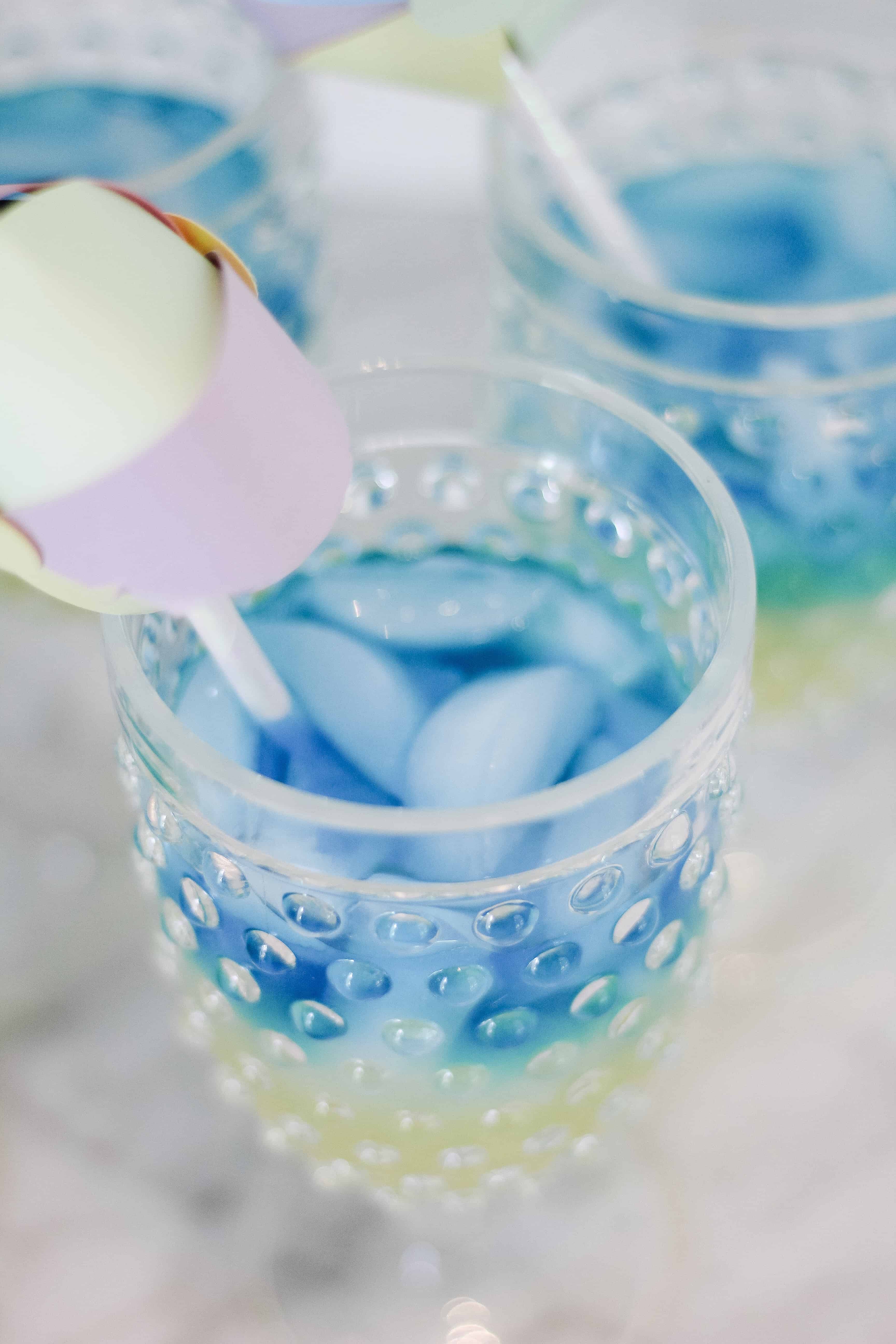 birds eye view of blue and yellow layered cocktail