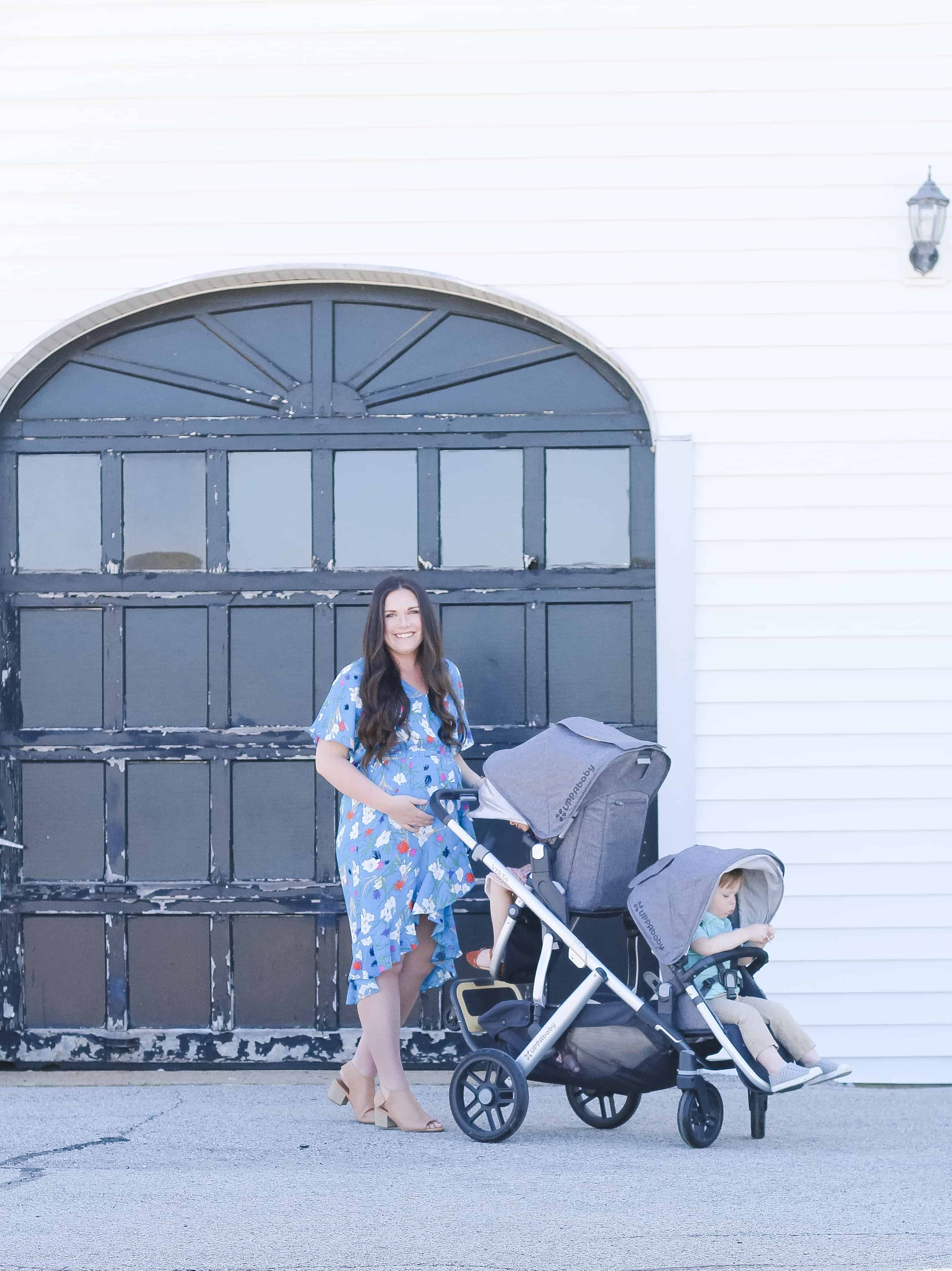 Pregnant mom pushing UPPAbaby VISTA double stroller
