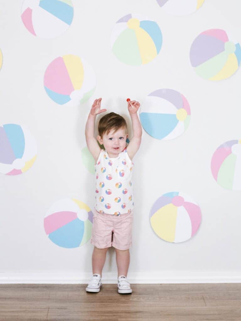 2 year old boy with beach ball decor 