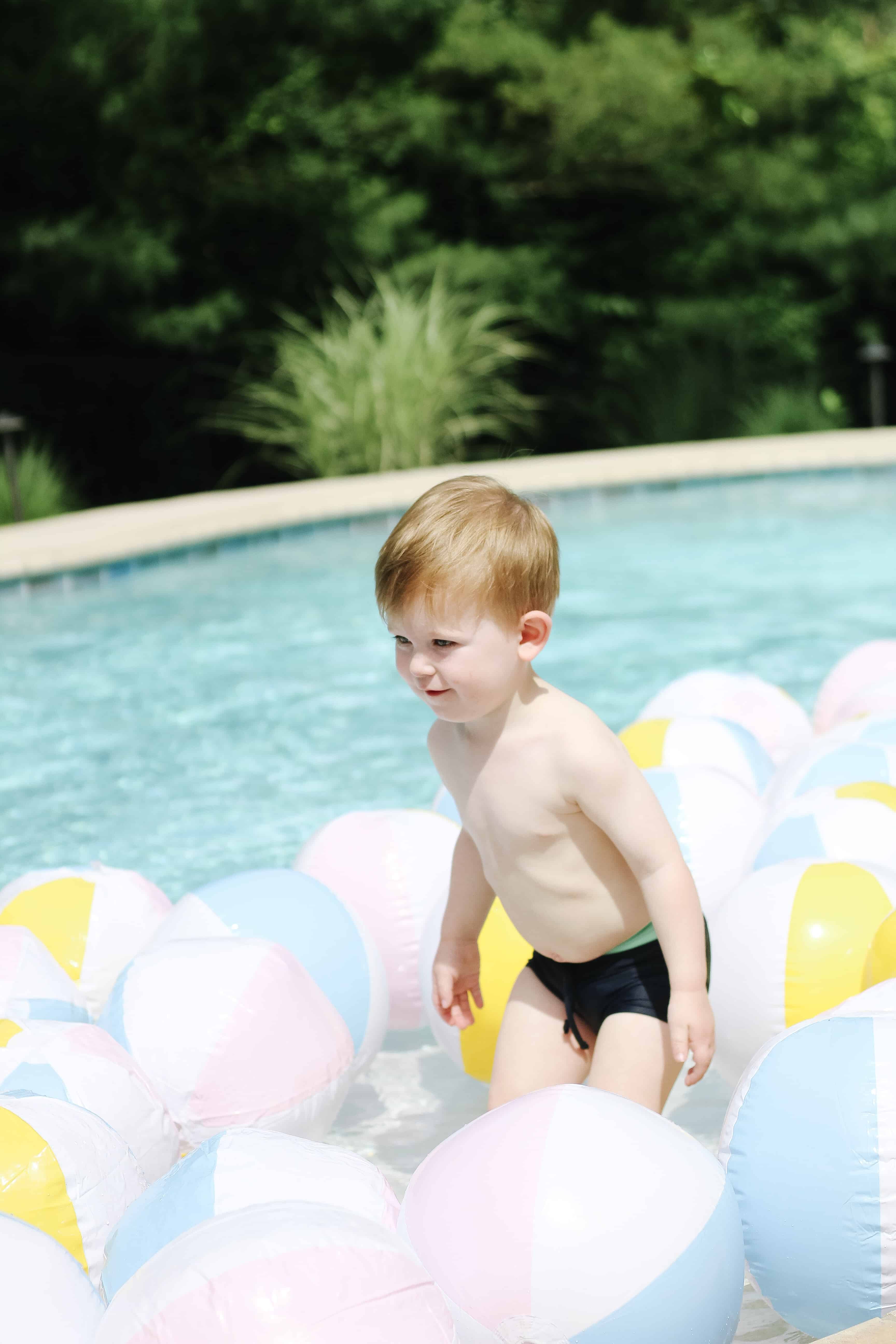 Beach ball's and a toddler in pool