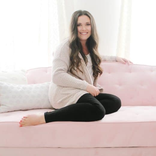 mom sitting on pink couch