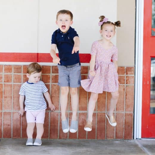 Kids jumping in front of Chuck E. Cheese