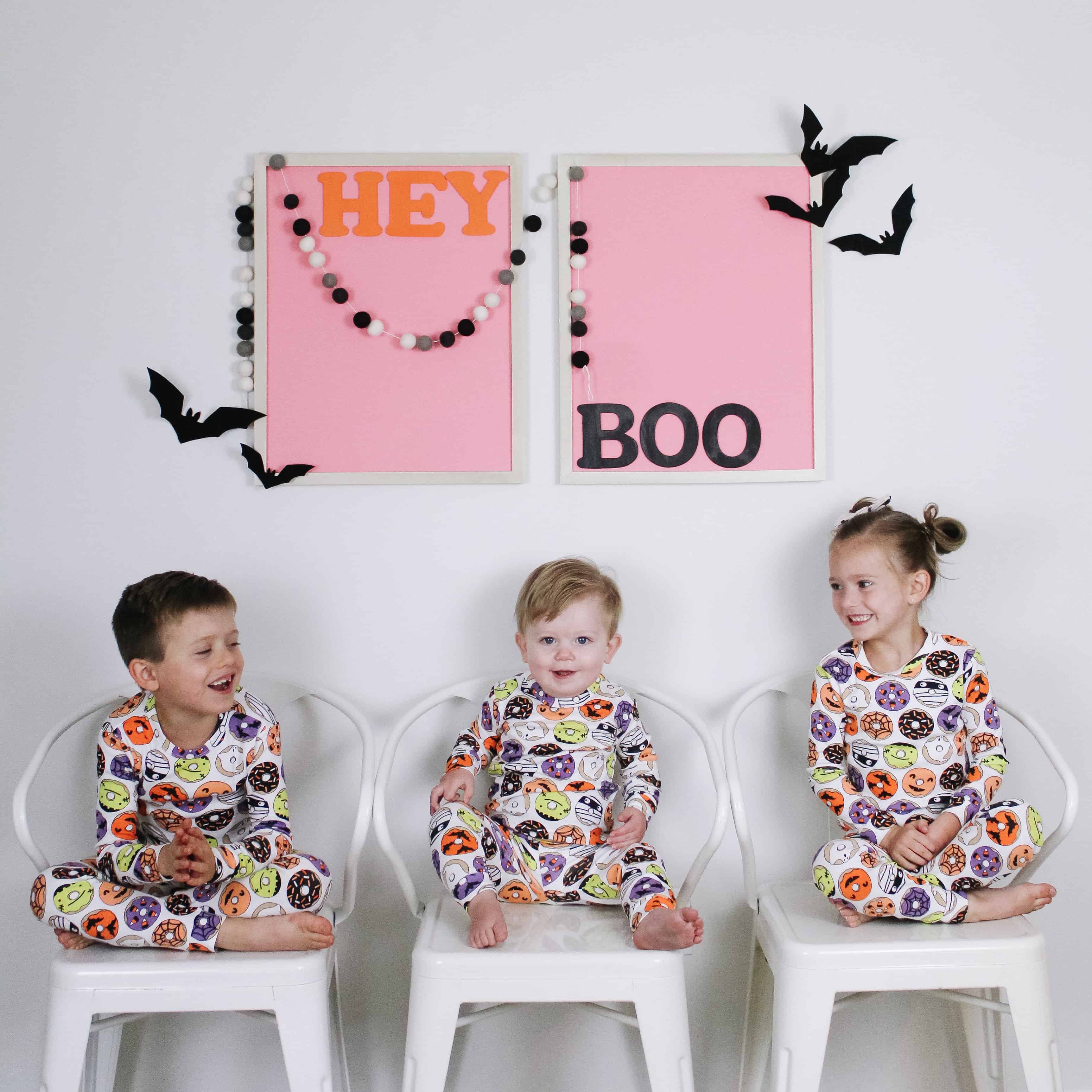 3 kids in matching halloween pajamas
