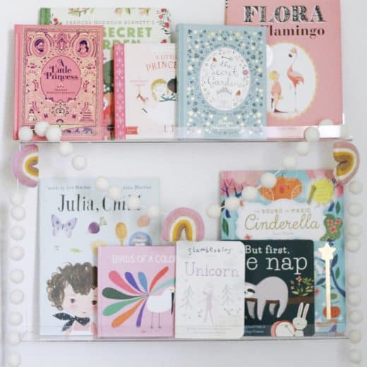 clear book ledges with children's books.