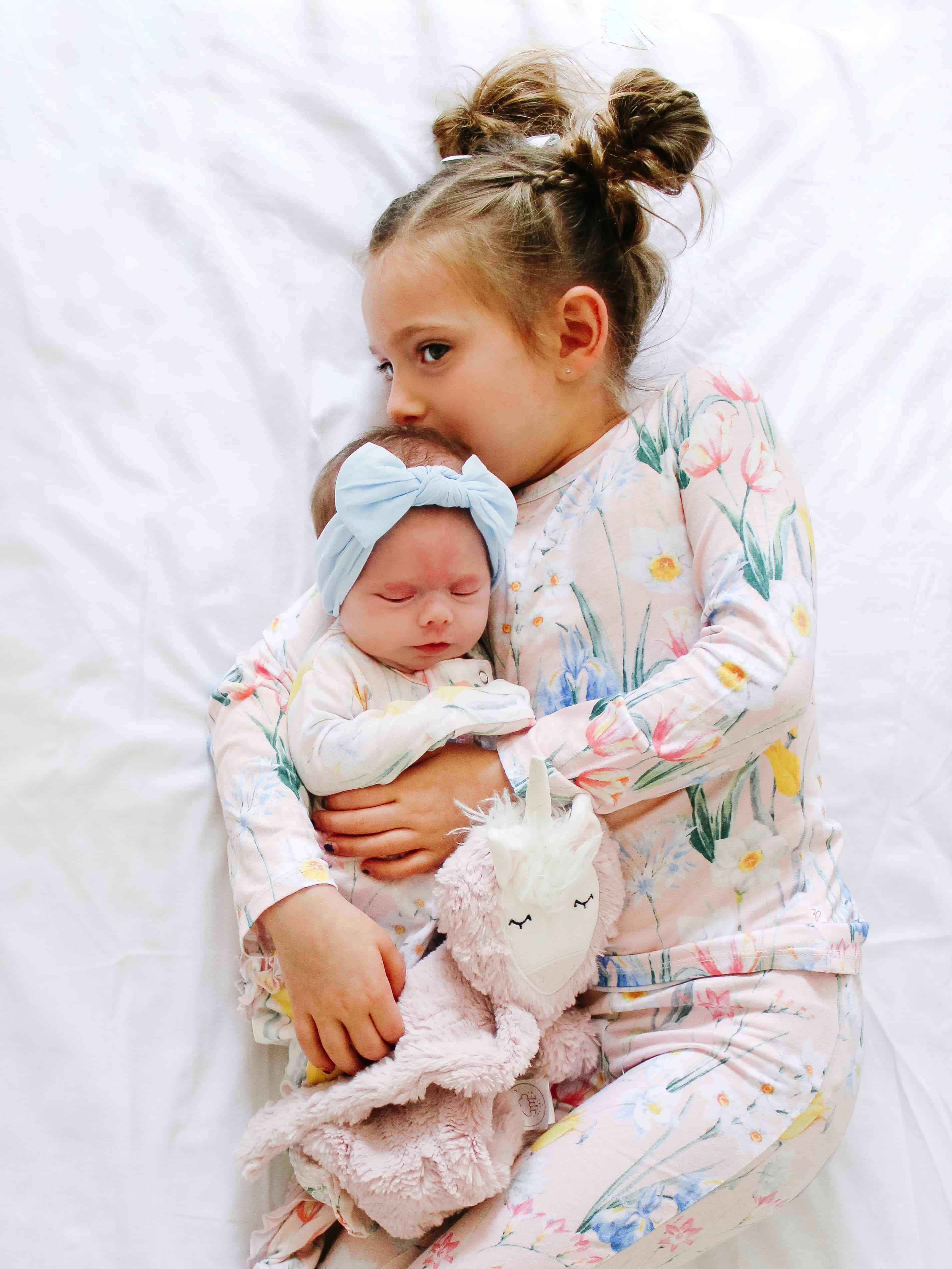 Sisters in matching pajamas sleeping