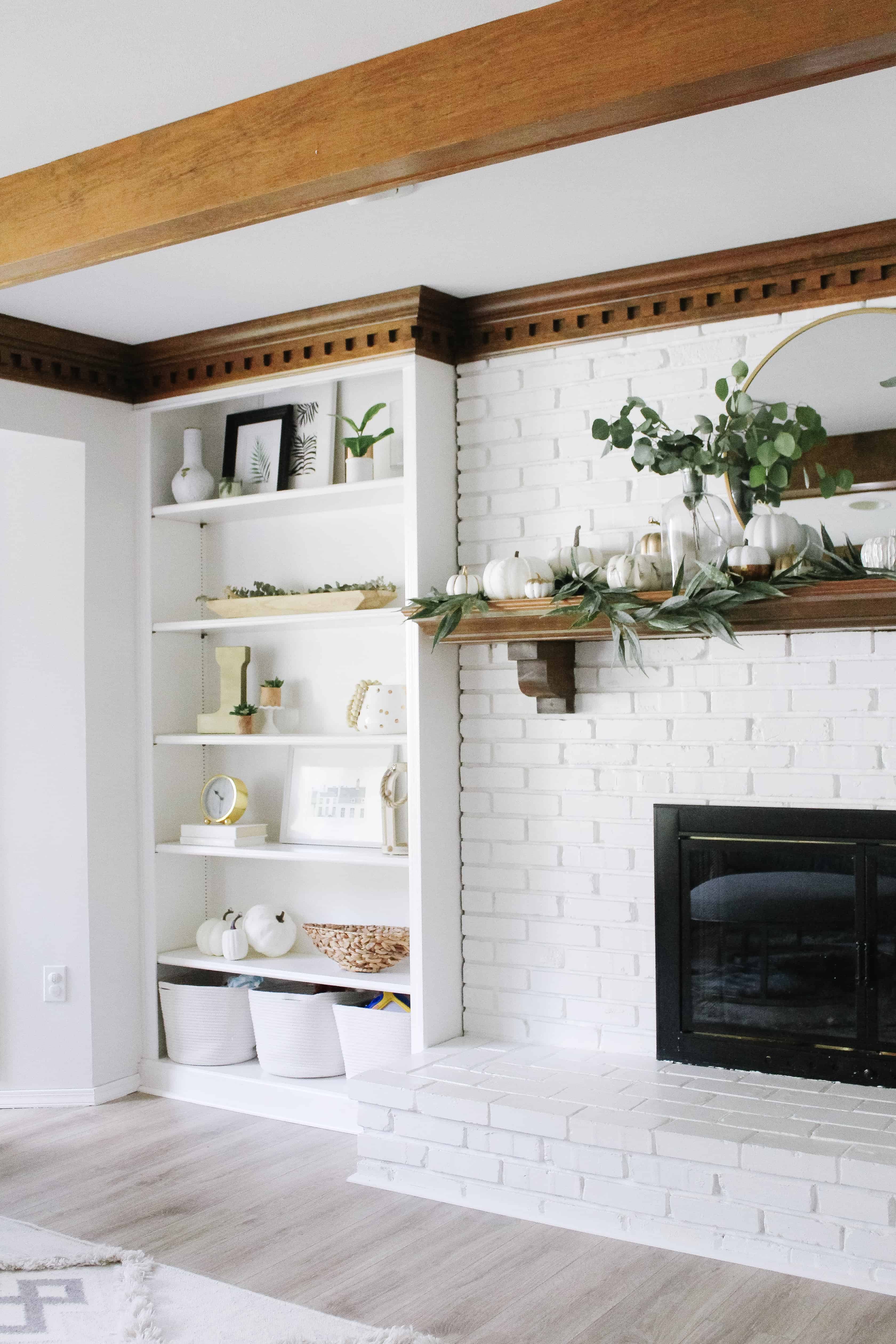 White mantle and built ins with fall decor