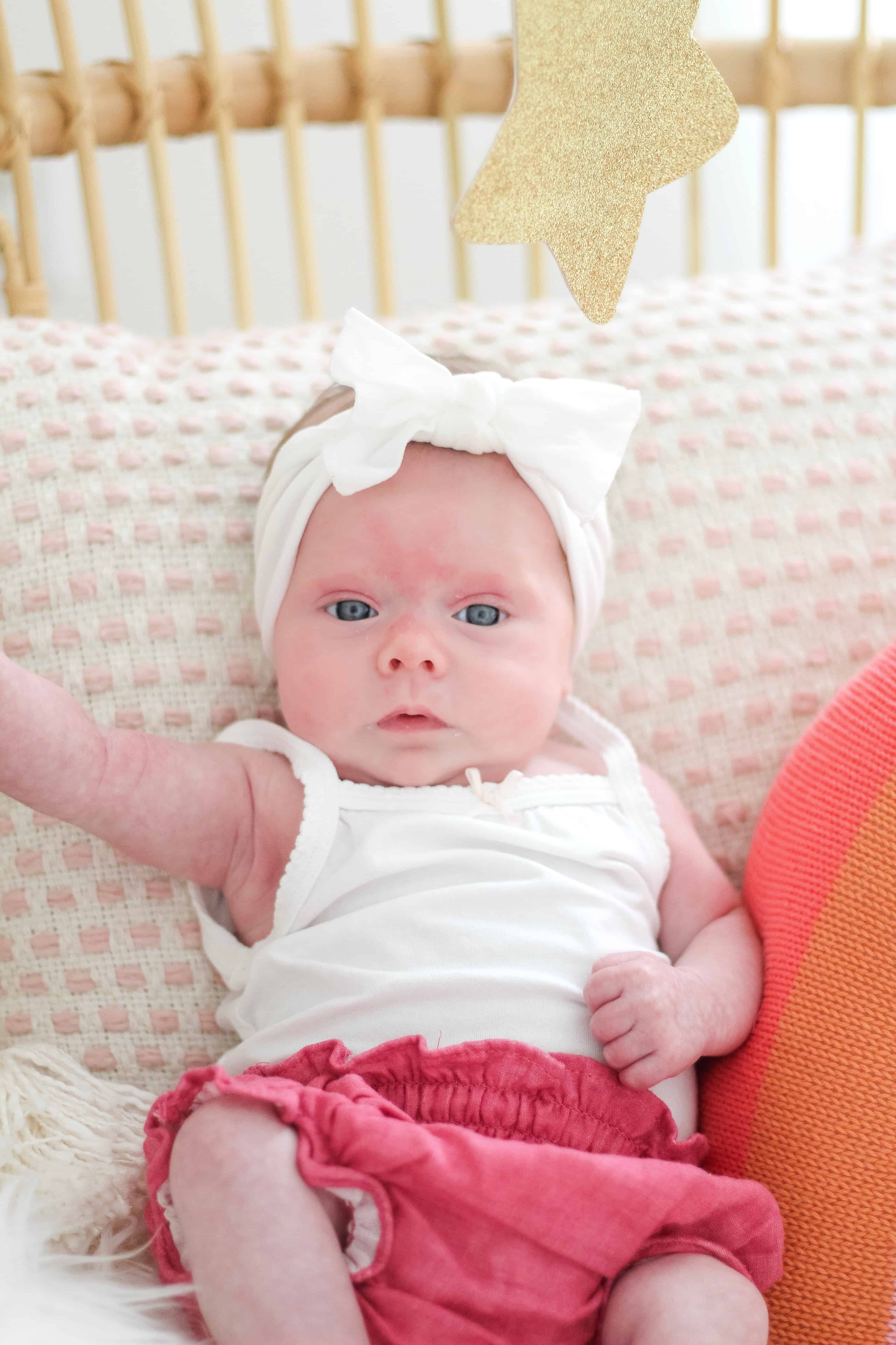 baby girl in white baby bling bow