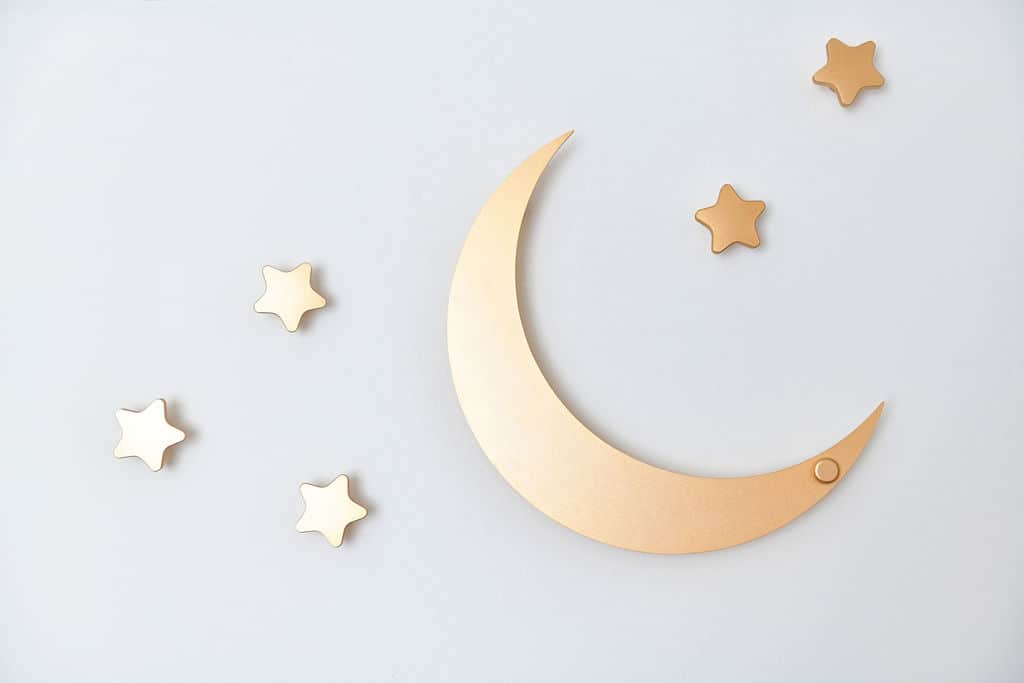 gold star and moon hooks on wall