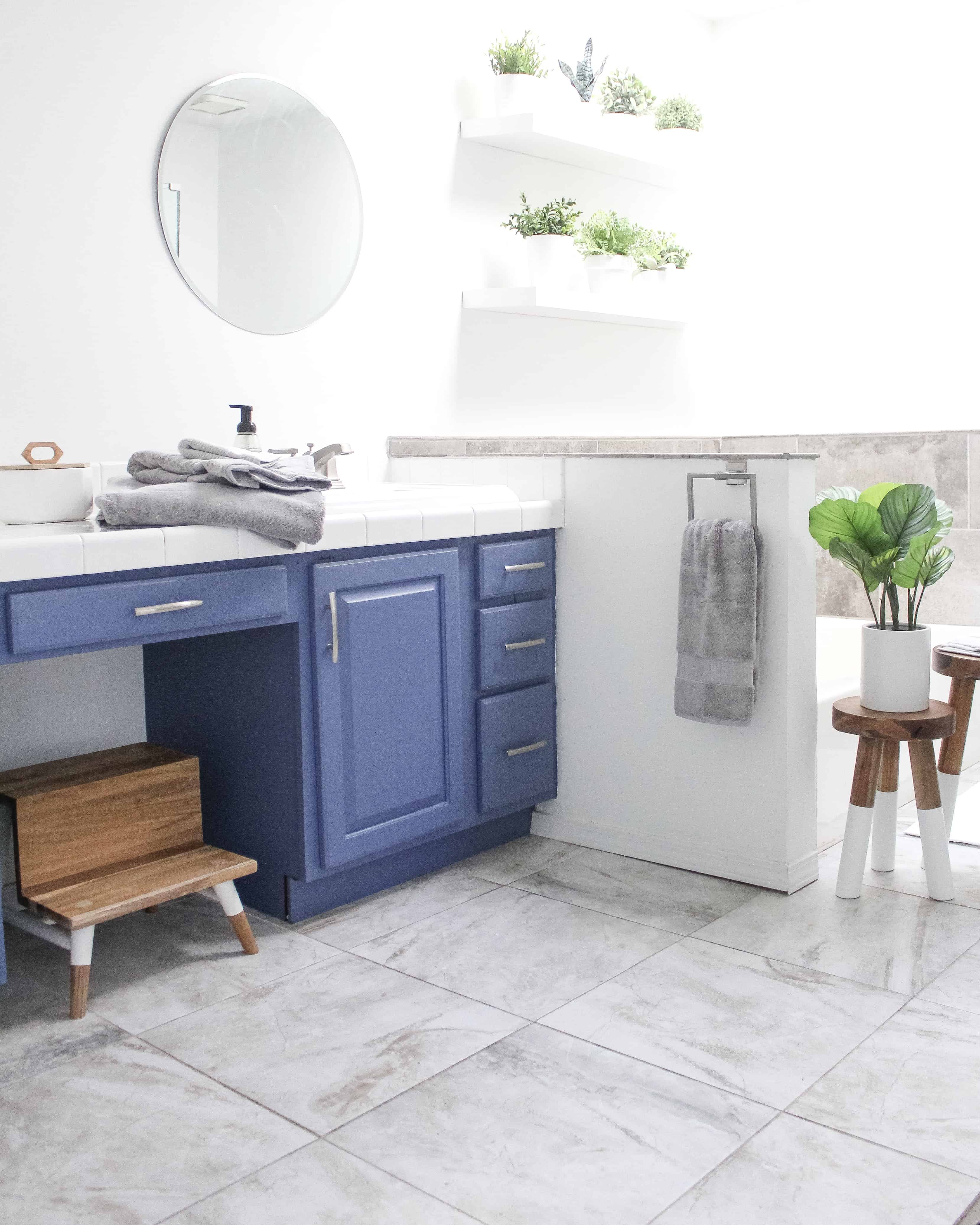 Bathroom with blue cabinets