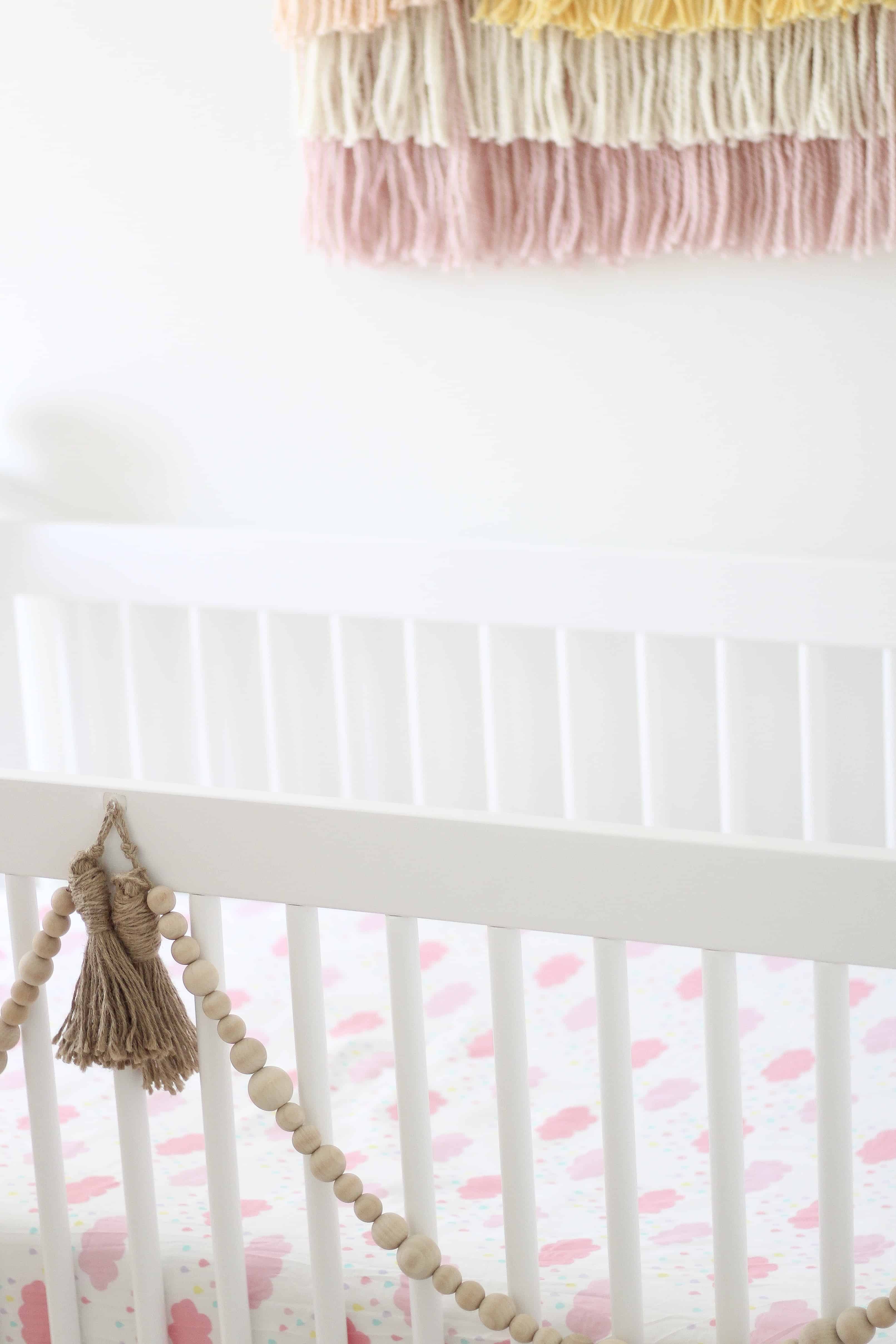 Cloud themed sheet in baby crib