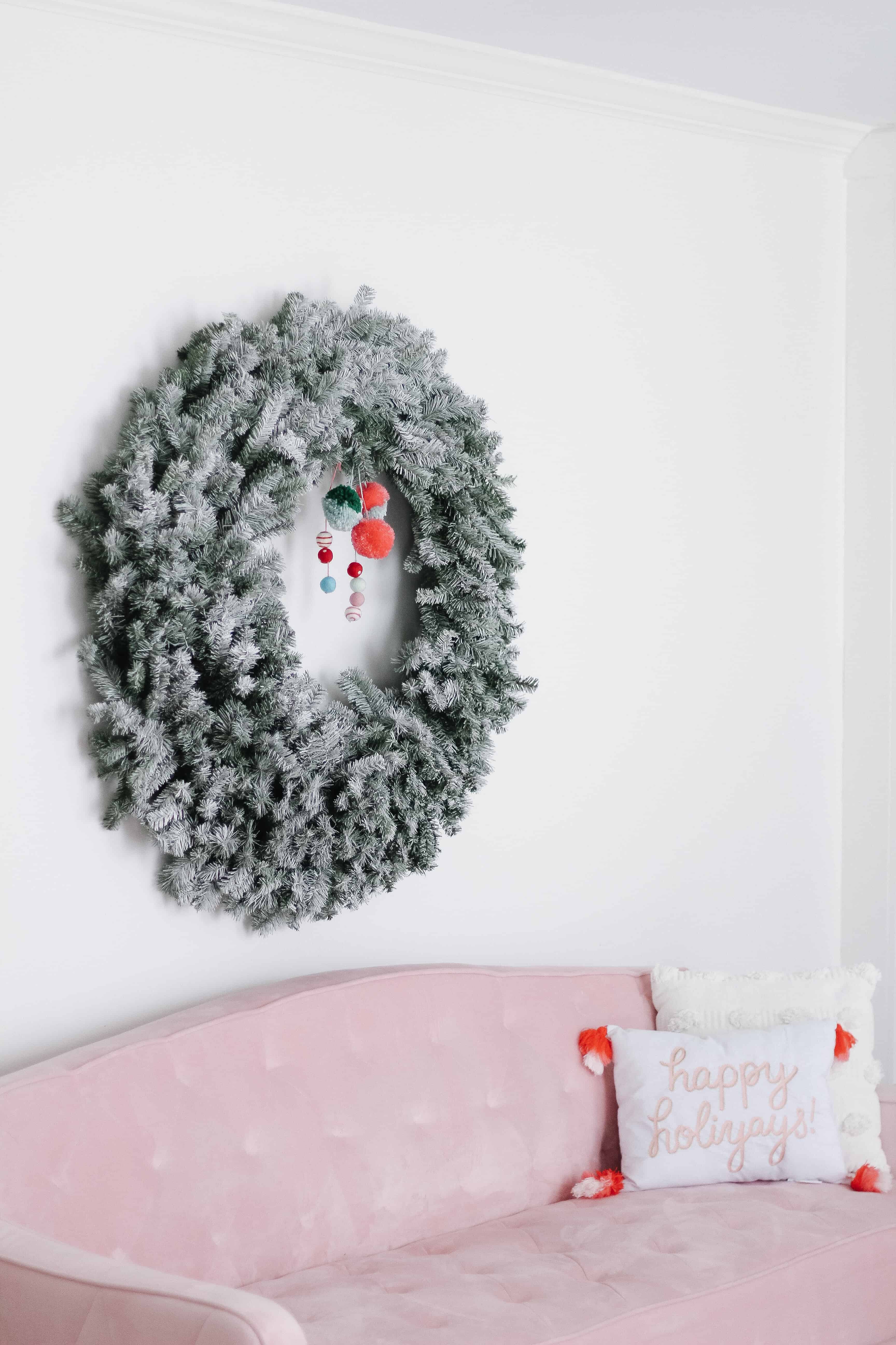 Large Flocked Wreath over Pink couch