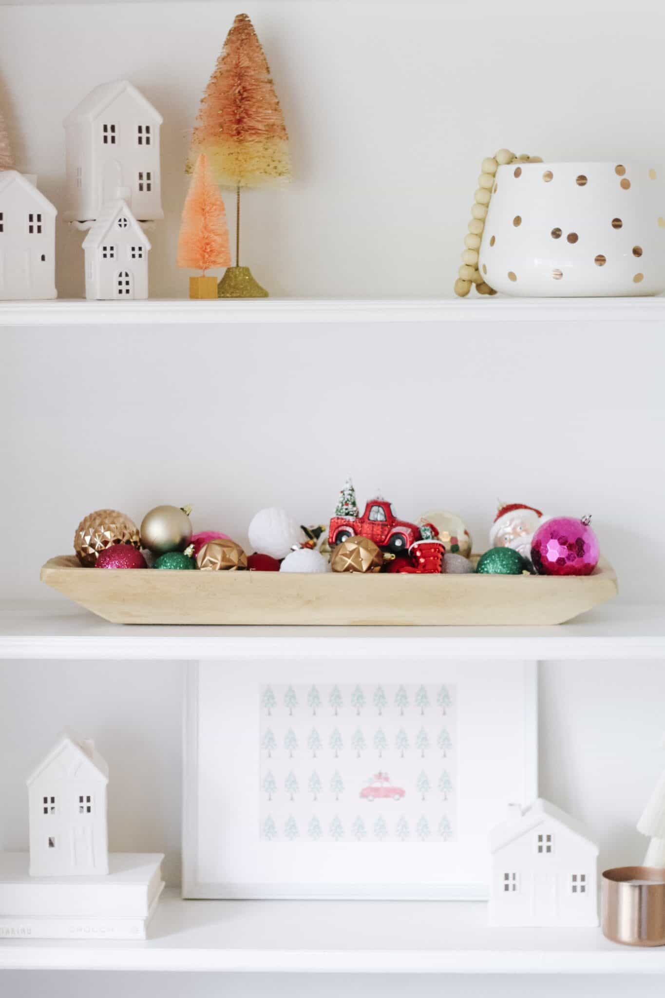 Wood bowl with ornaments on built in shelves