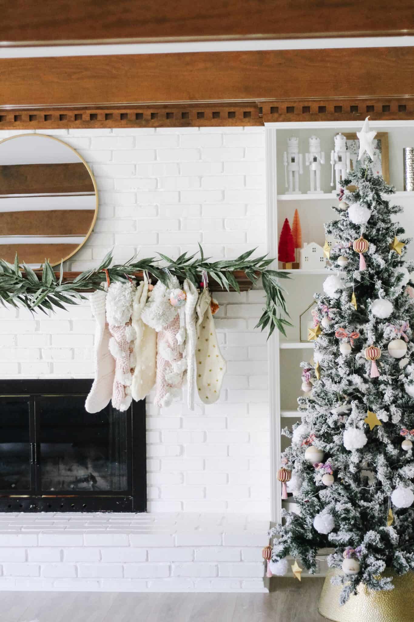 white mantle with stockings and modern garland