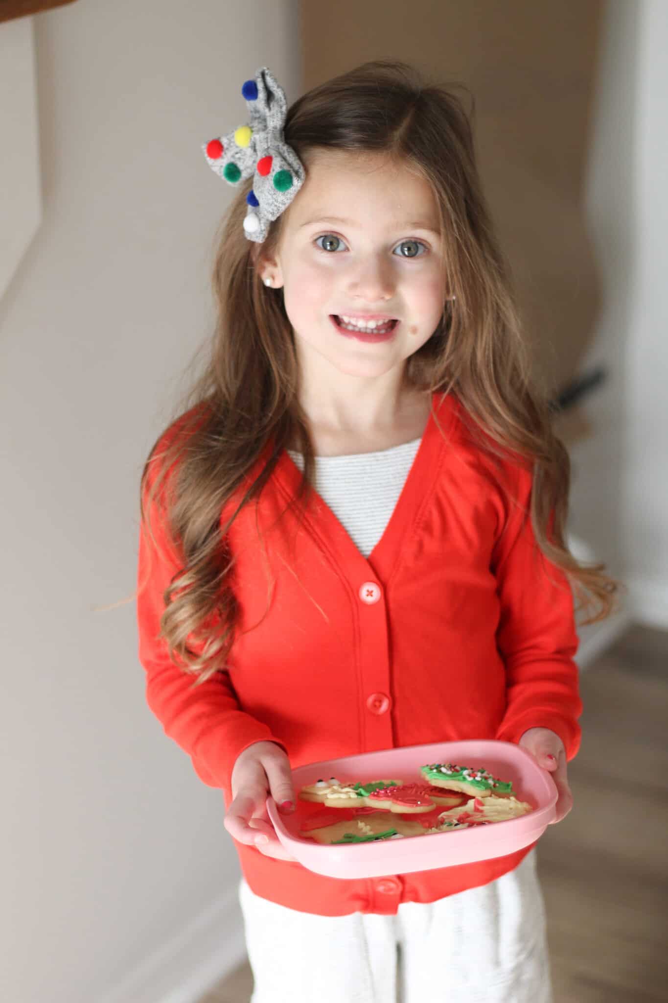 Little girl delivering cookies