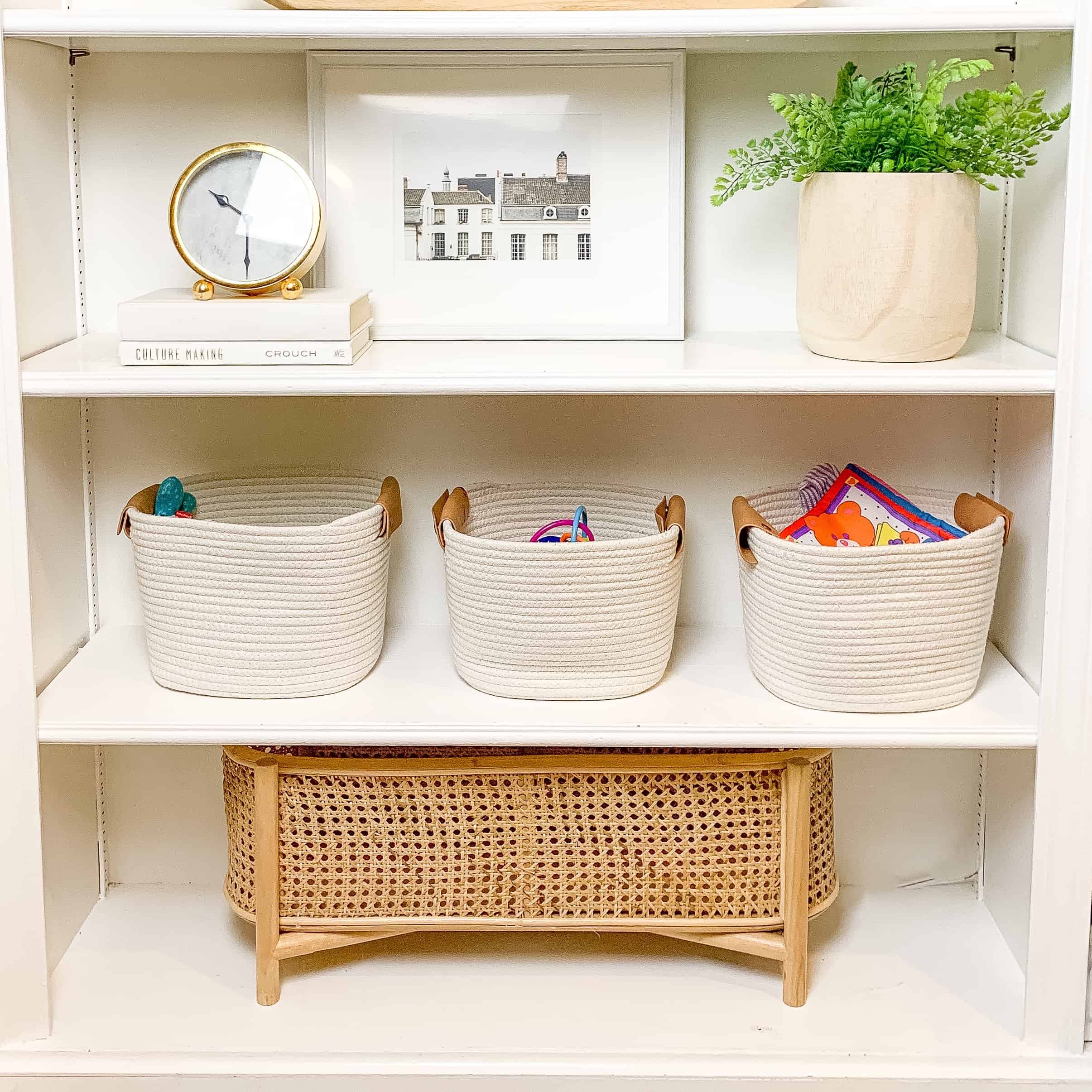 built ins with white baskets and natural decor