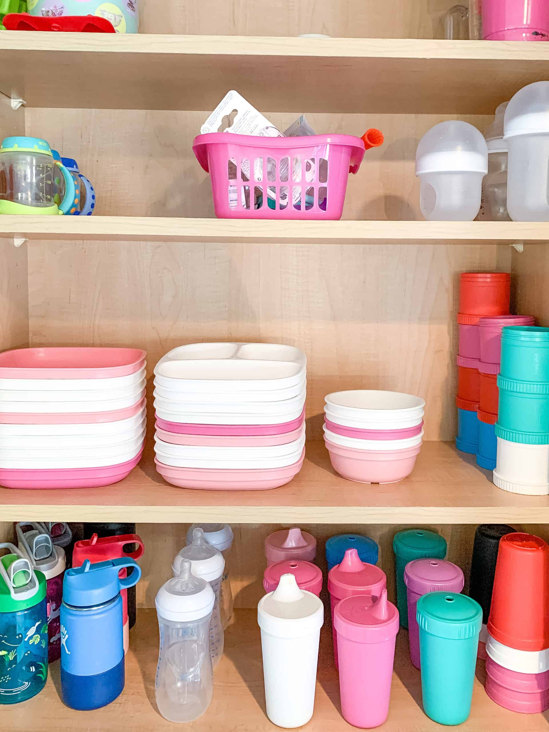 cupboard with replay recycled cups and plates organized