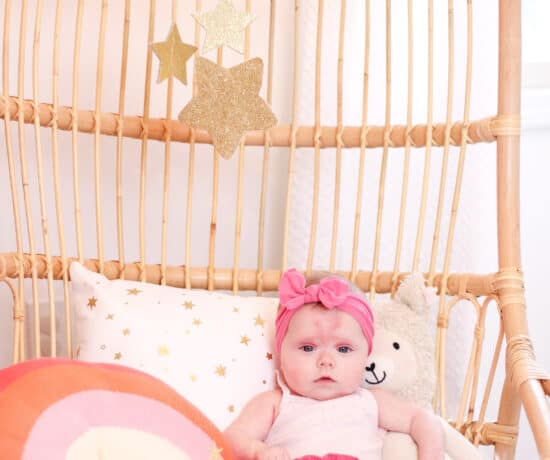 4 month old baby in rattan chair