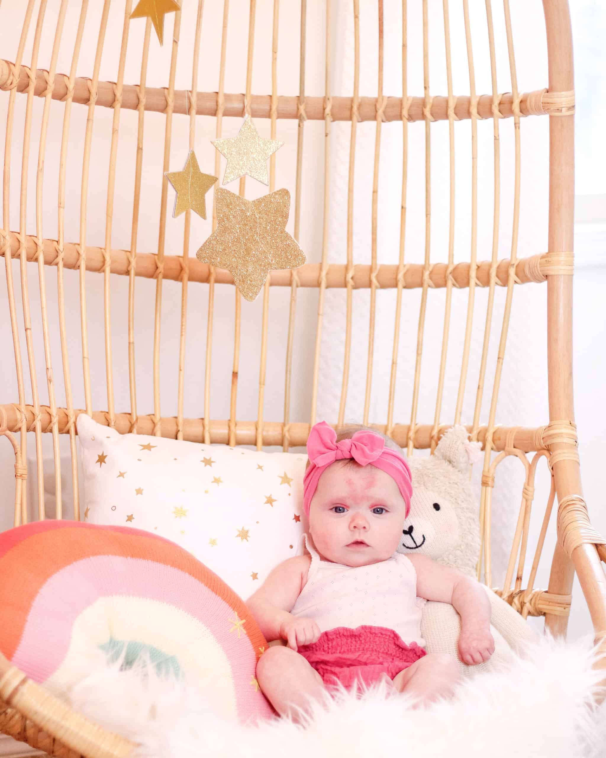 4 month old baby in rattan chair