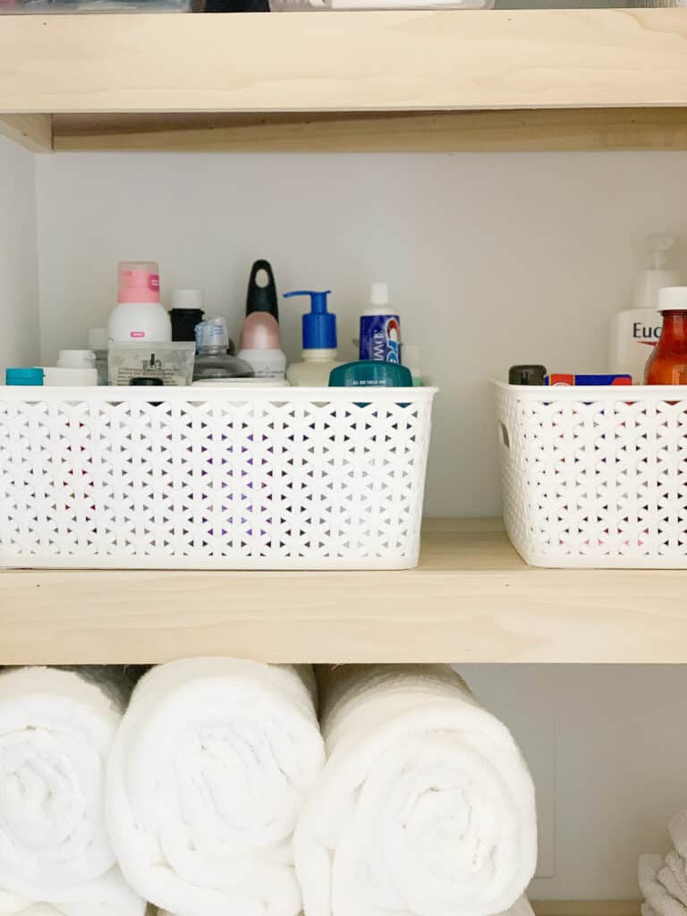 Organized linen closet shelves