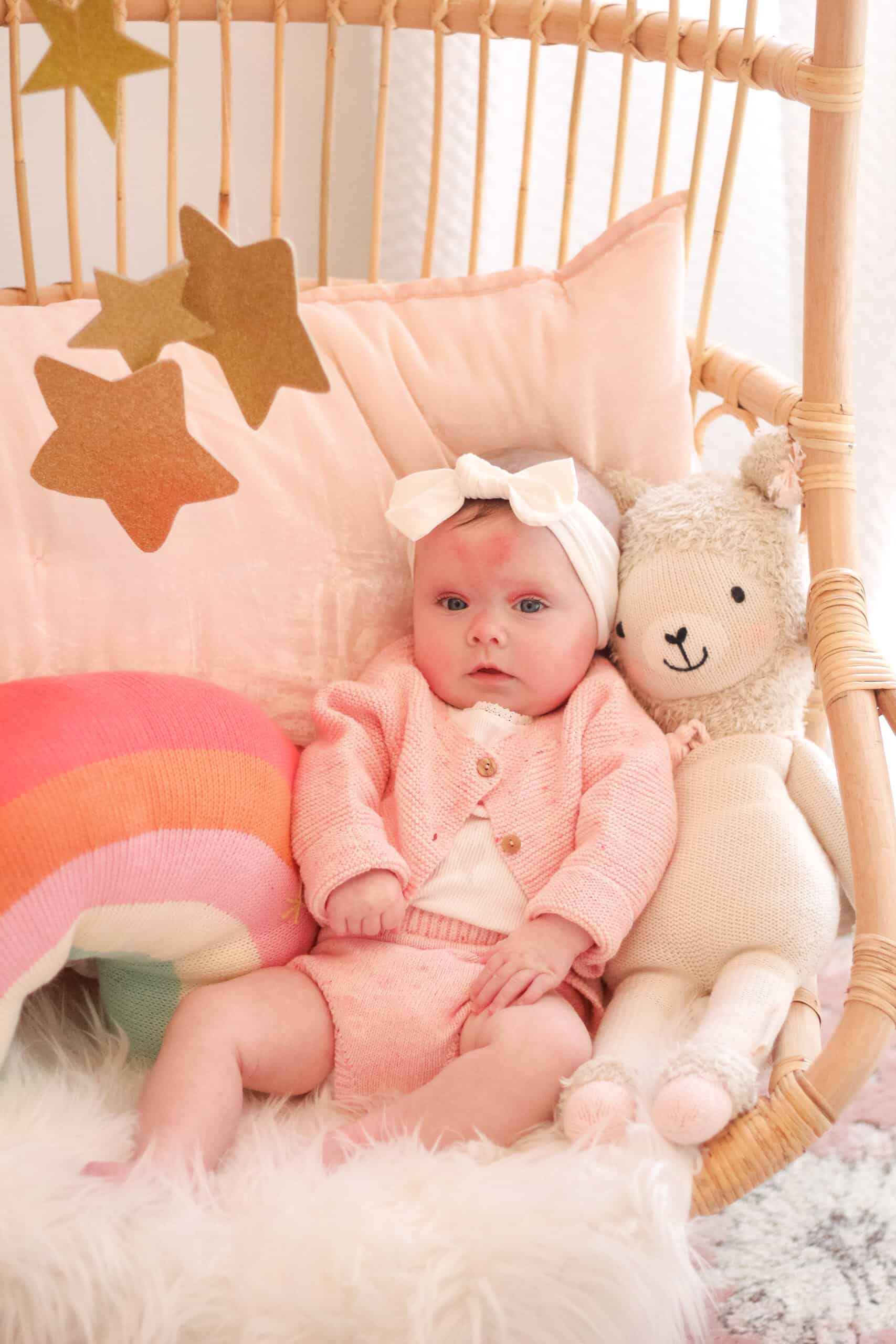 5 month old baby girl in Serena and lily chair