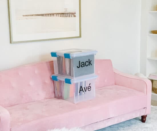 school work bins on pink couch