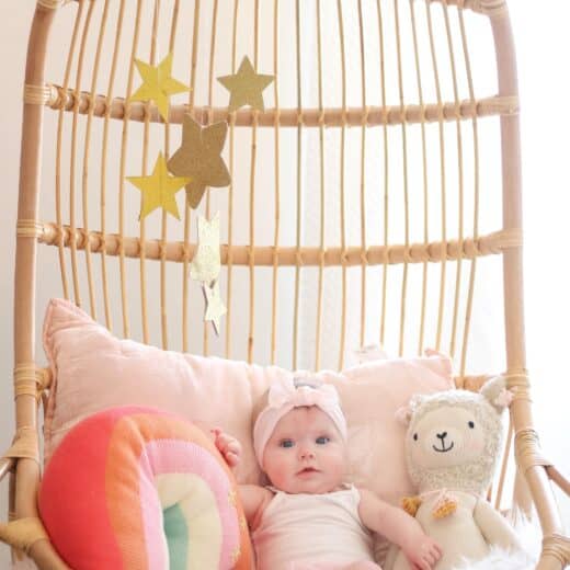 6 month old baby in Serena and lily hanging chair