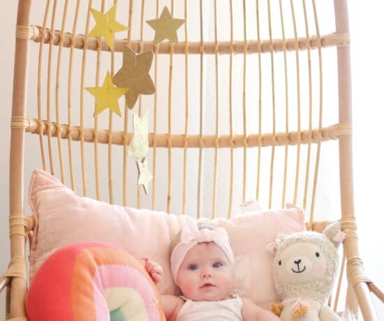 6 month old baby in Serena and lily hanging chair