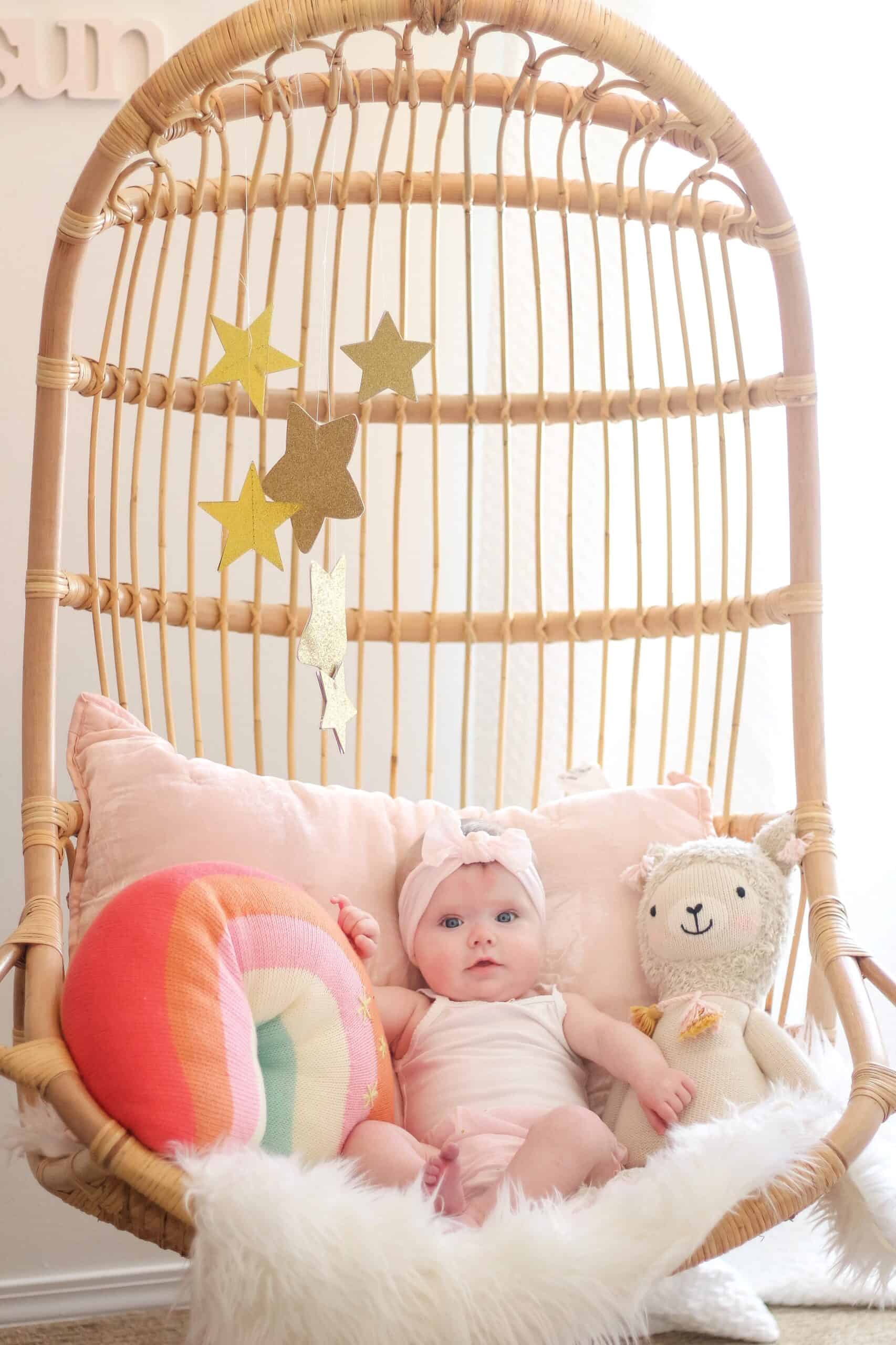 6 month old baby in Serena and lily hanging chair