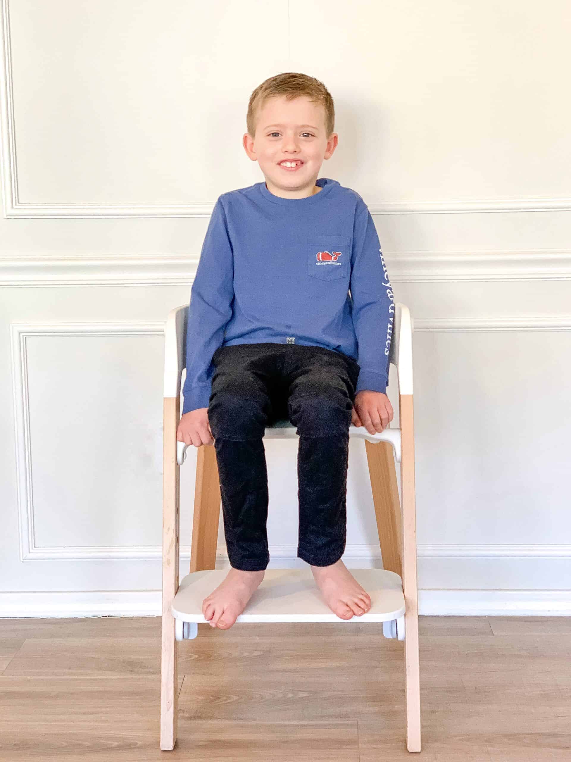 7 year old boy on stokke steps Chair