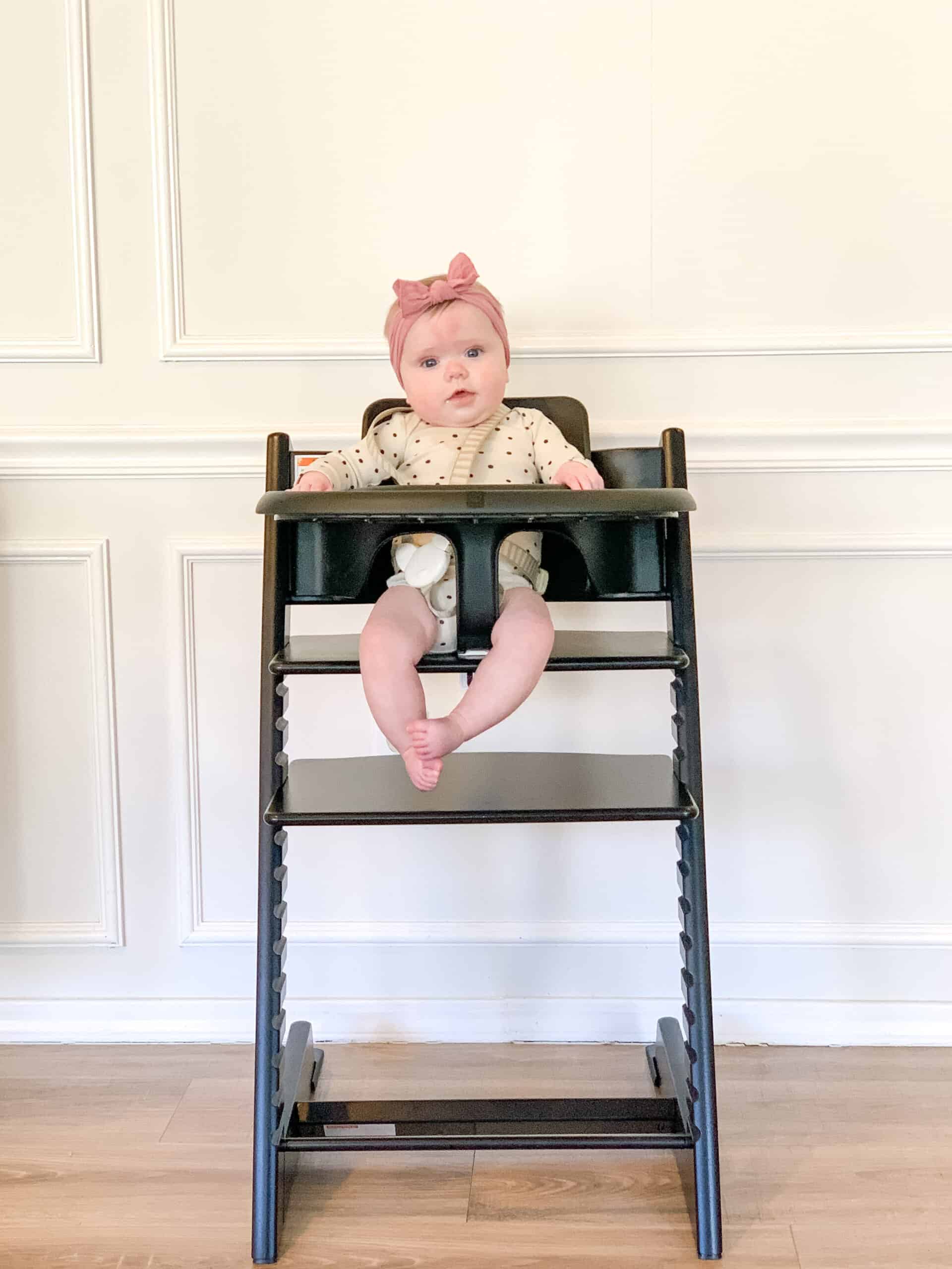 baby girl in Stokke Tripp Trapp Highchair