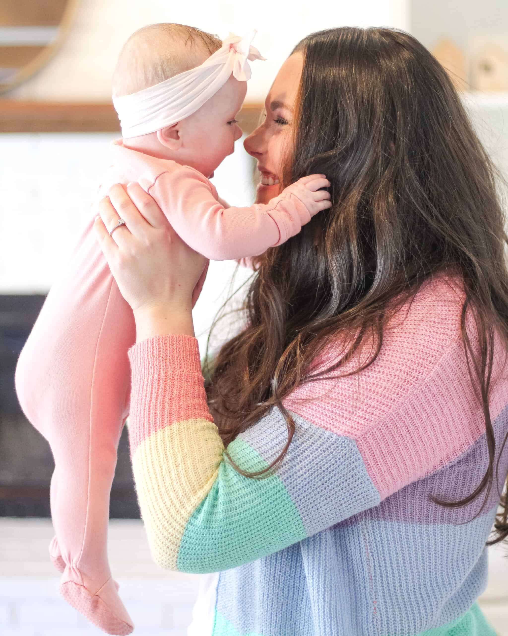 mom nose to nose with baby girl