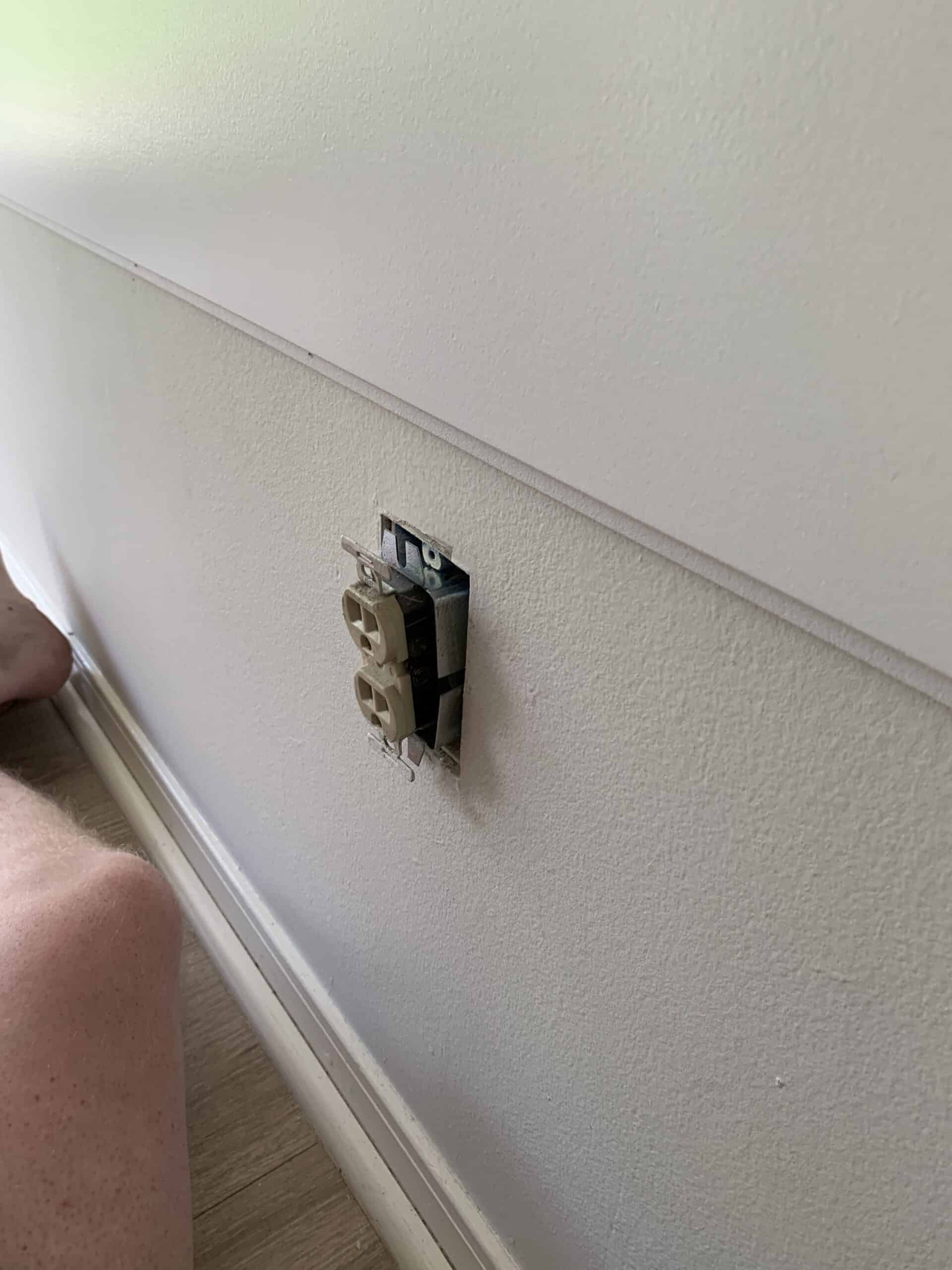 adding an outlet extender to a wall