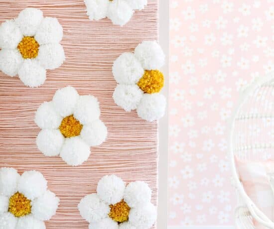 large daisy diy yarn wall art in girls bedroom