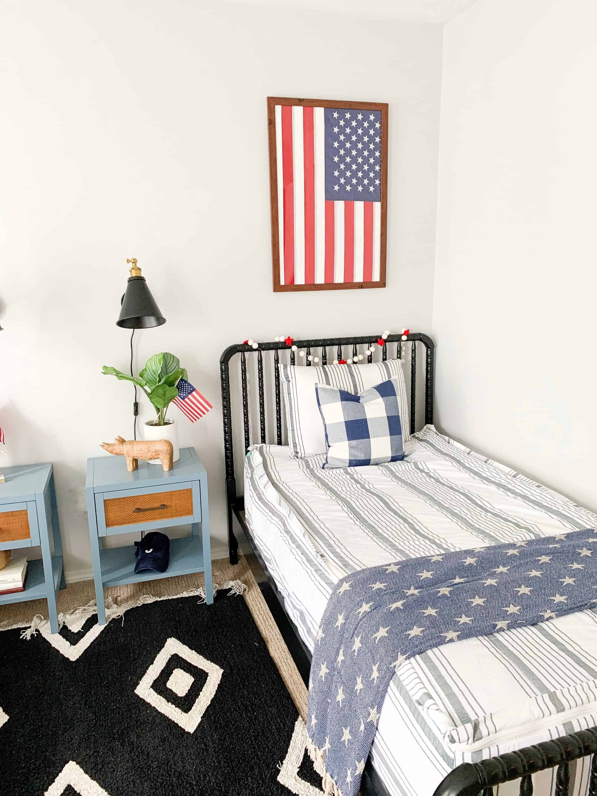 boys room with flag framed above bed